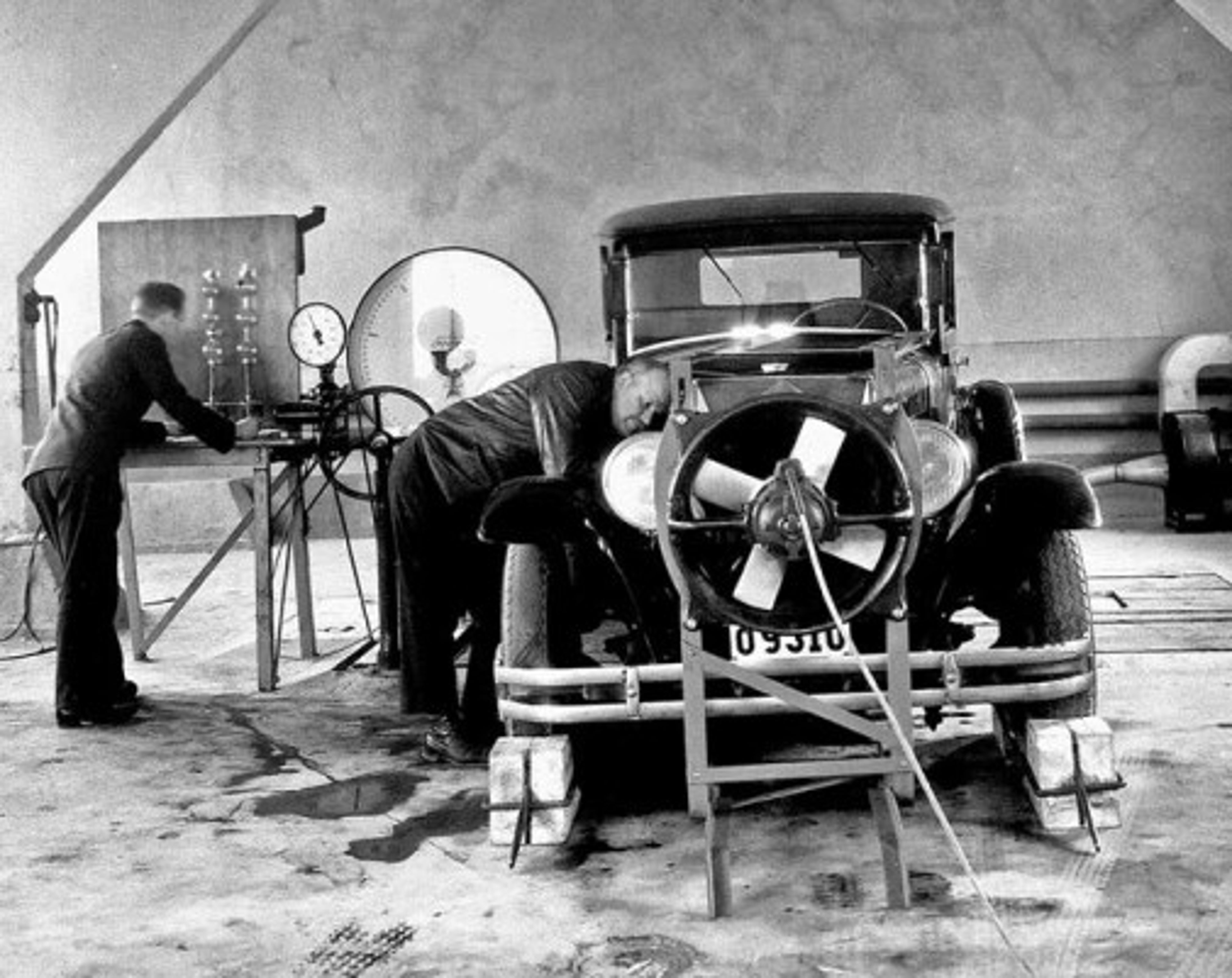 Volvo PV 51 with the hood open and a man standing next to it.