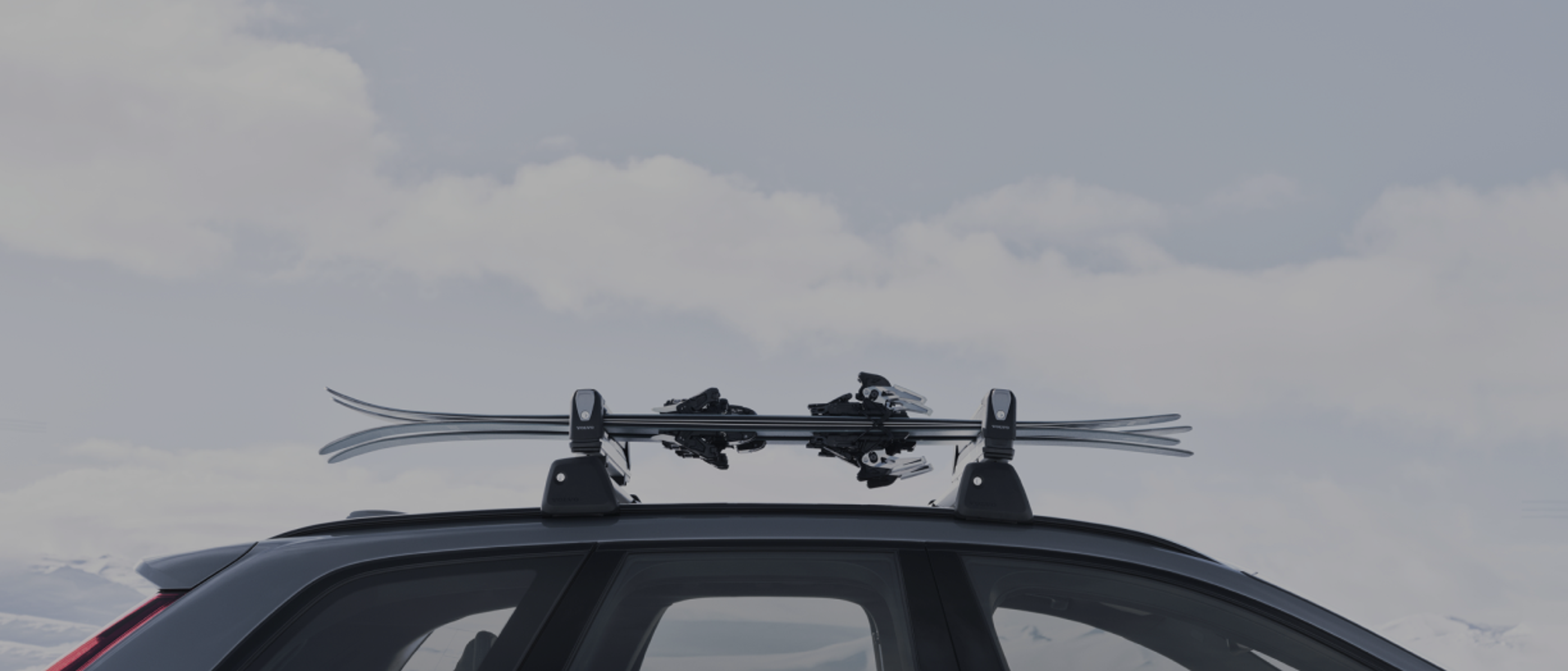A partial view of car’s roof with a roof rack.