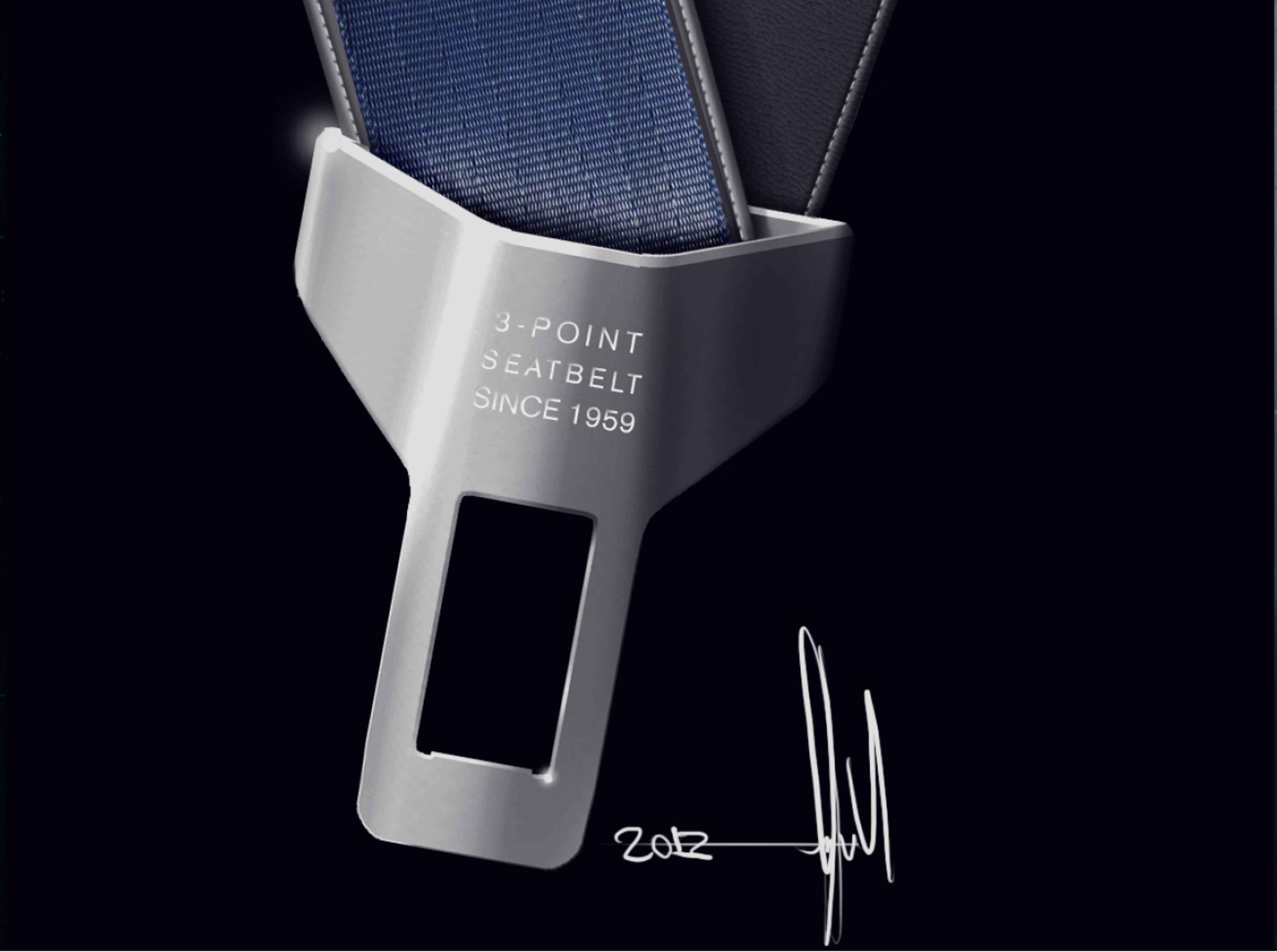 Close up of a seatbelt buckle with the “3-POINT SEATBELT SINCE 1959” inscription on it.