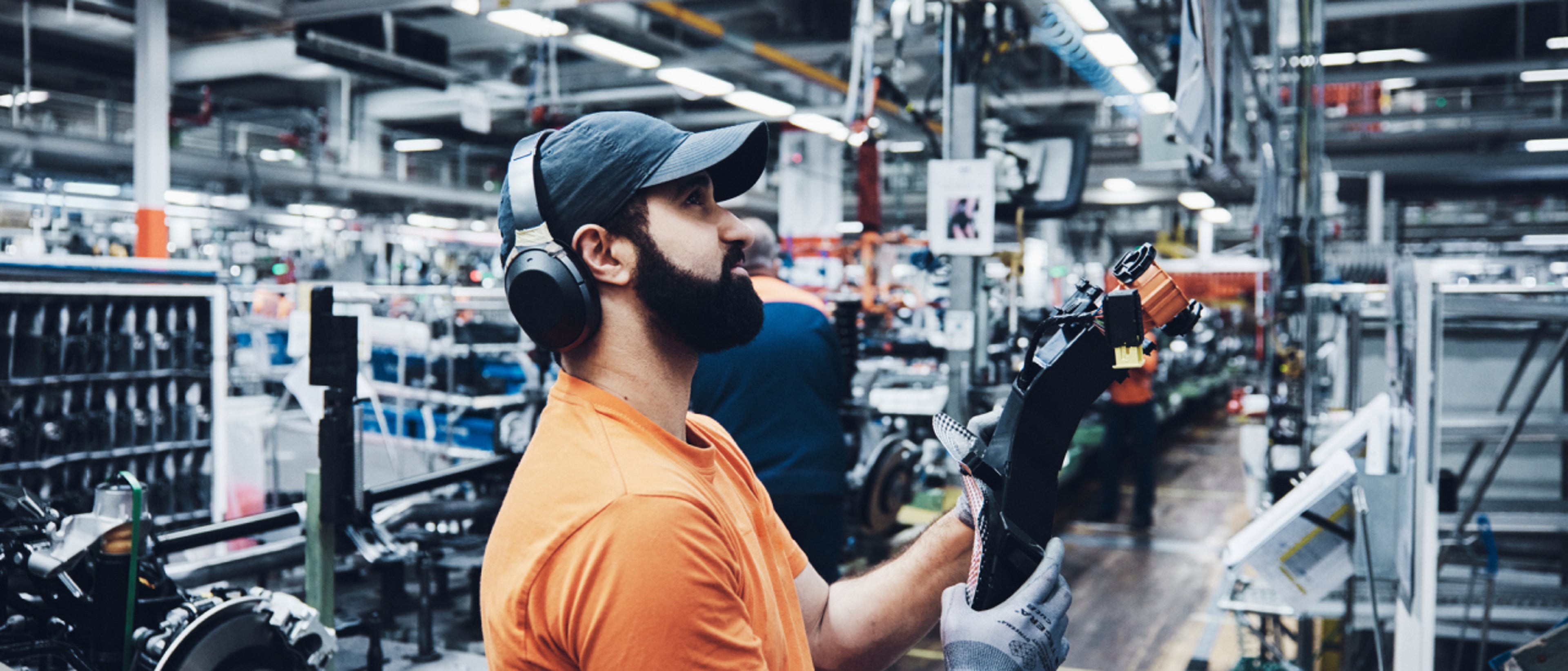 A man working inside a manufacturing plant.