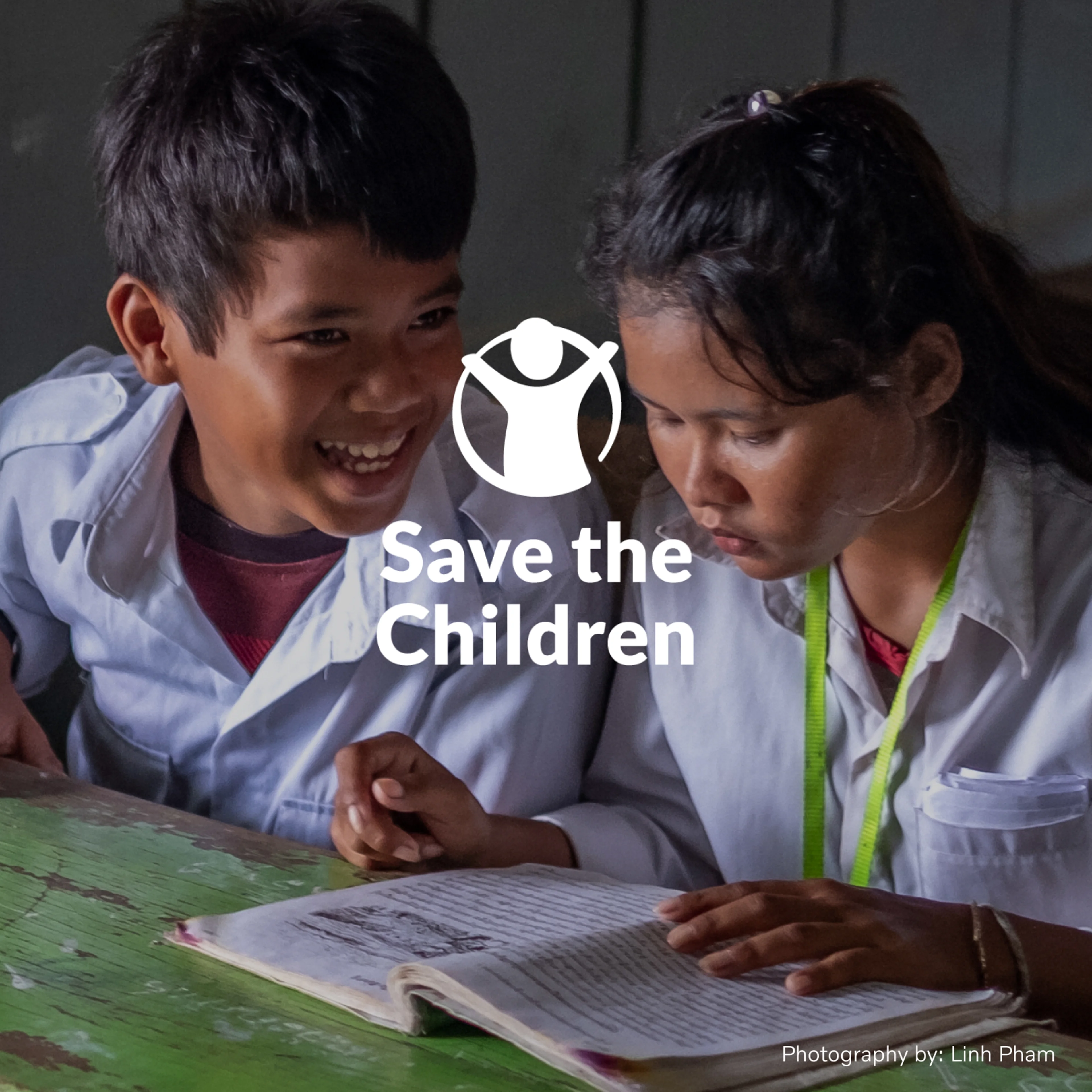 A young girl reading a book at a desk next to a young boy smiling with "Save the Children" overlaying the image.