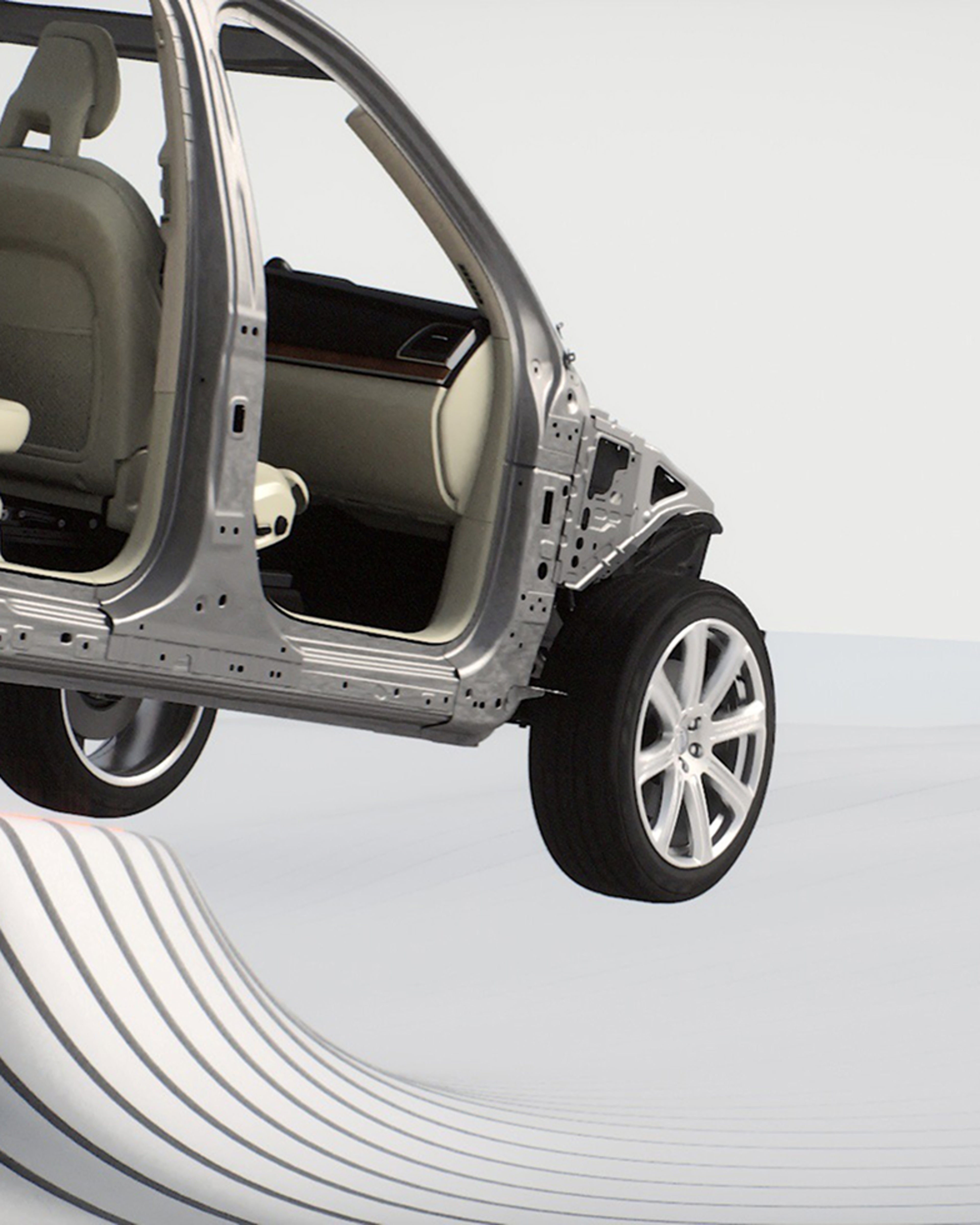 A partially assembled Volvo car on a simulated wave-like road surface against a grey background.