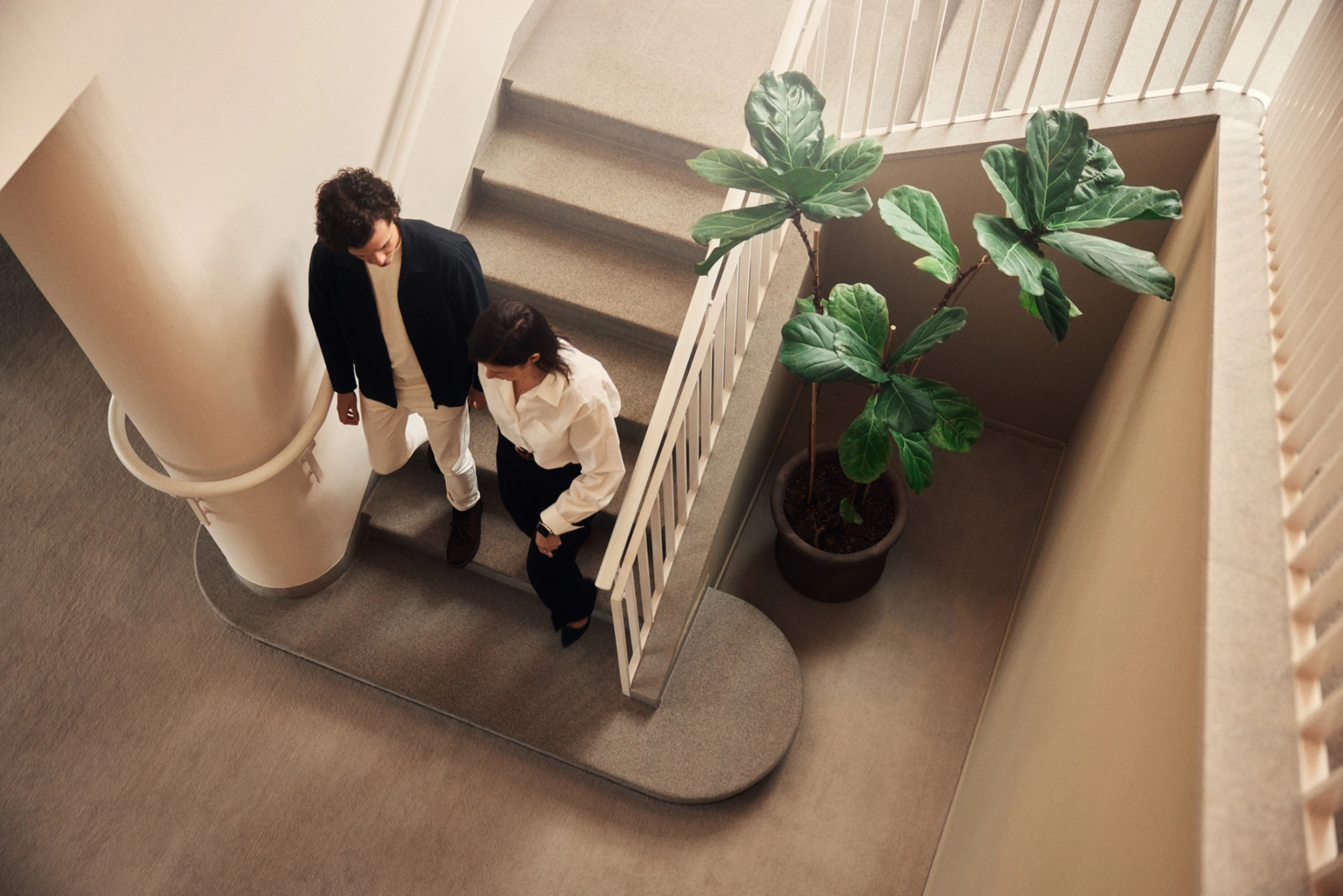 Employee group walking down stairs.