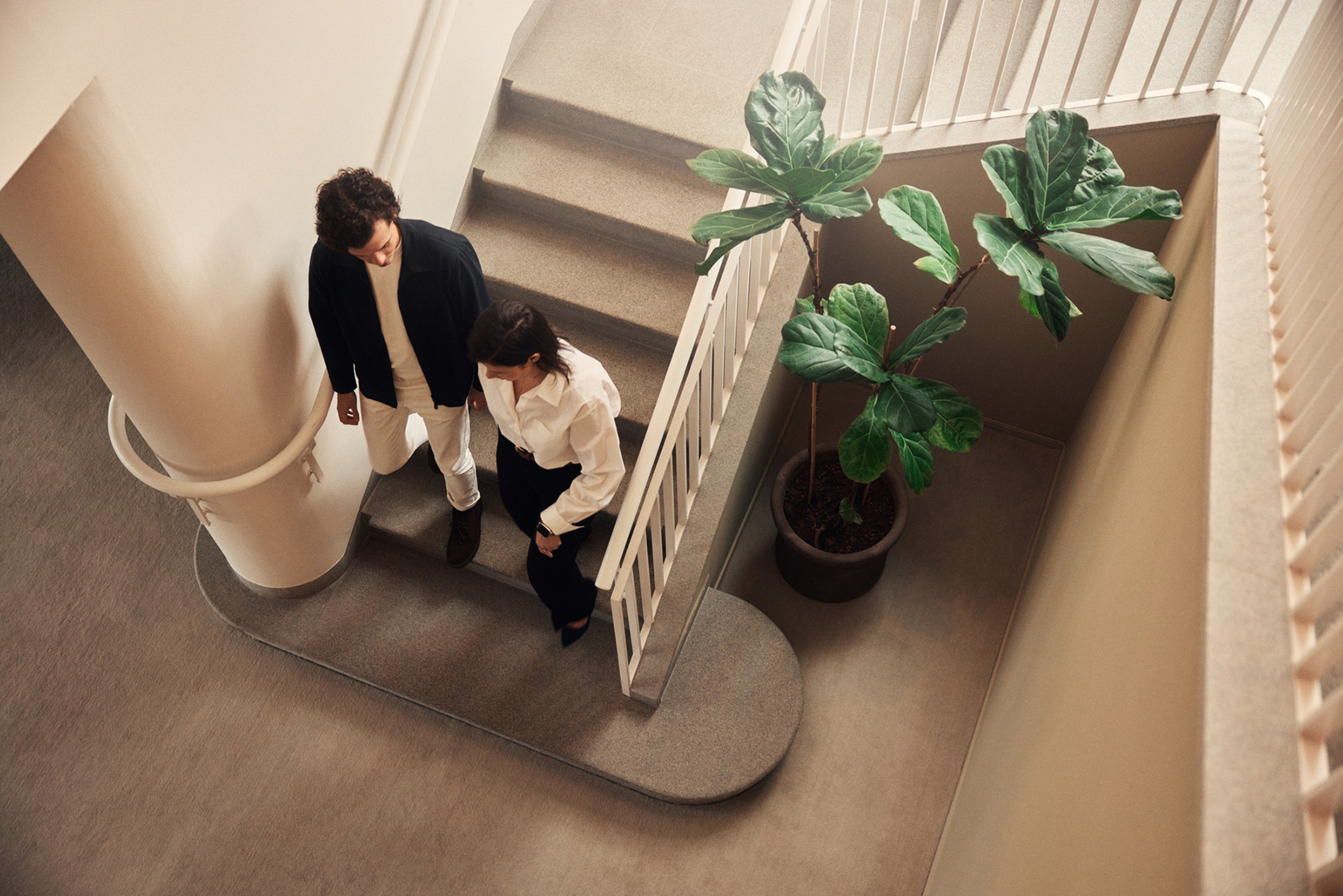 Employee group walking down stairs.