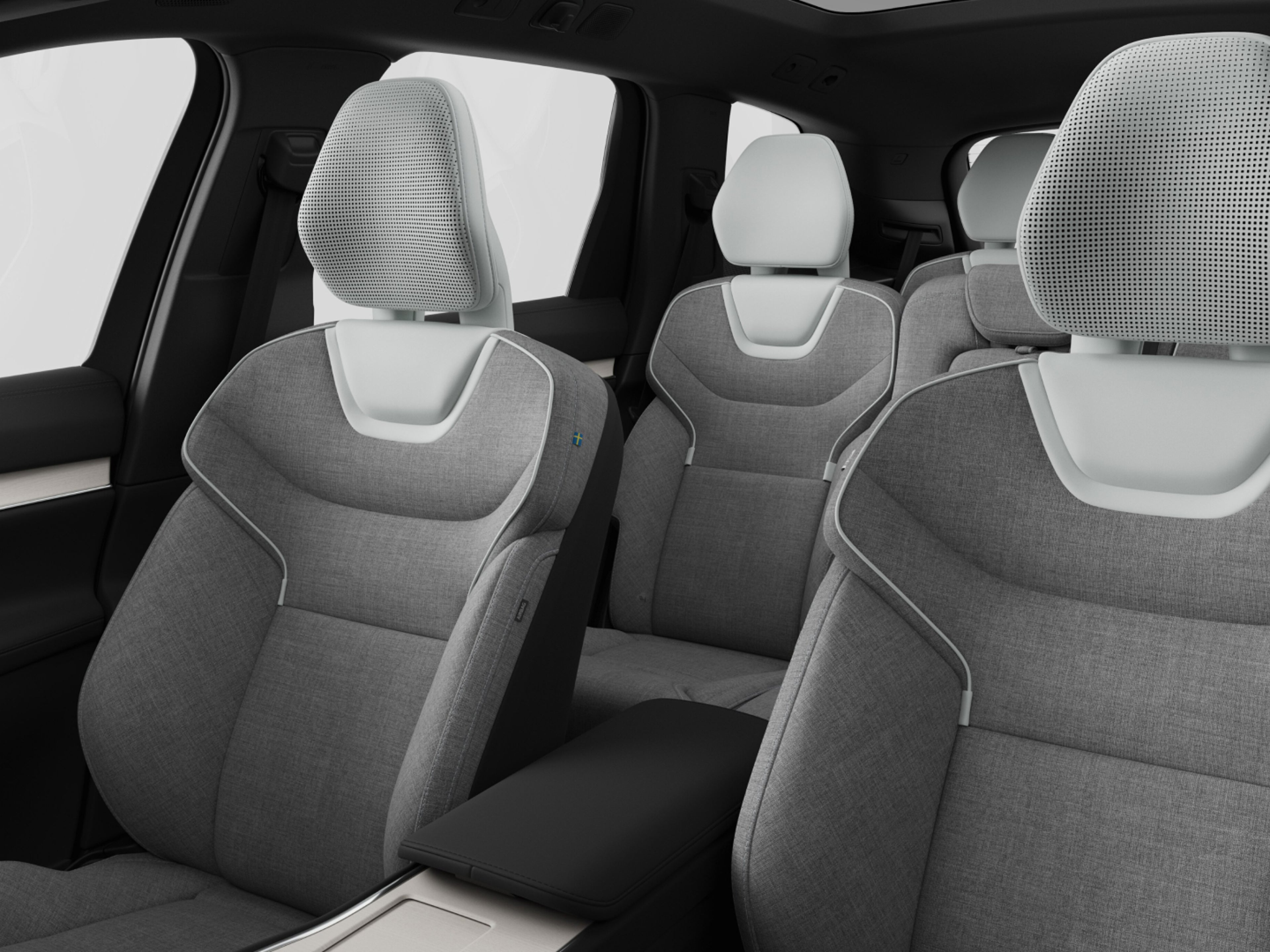 Uma configuração de sete lugares do interior do Volvo EX90 com bancos com mistura de lã.