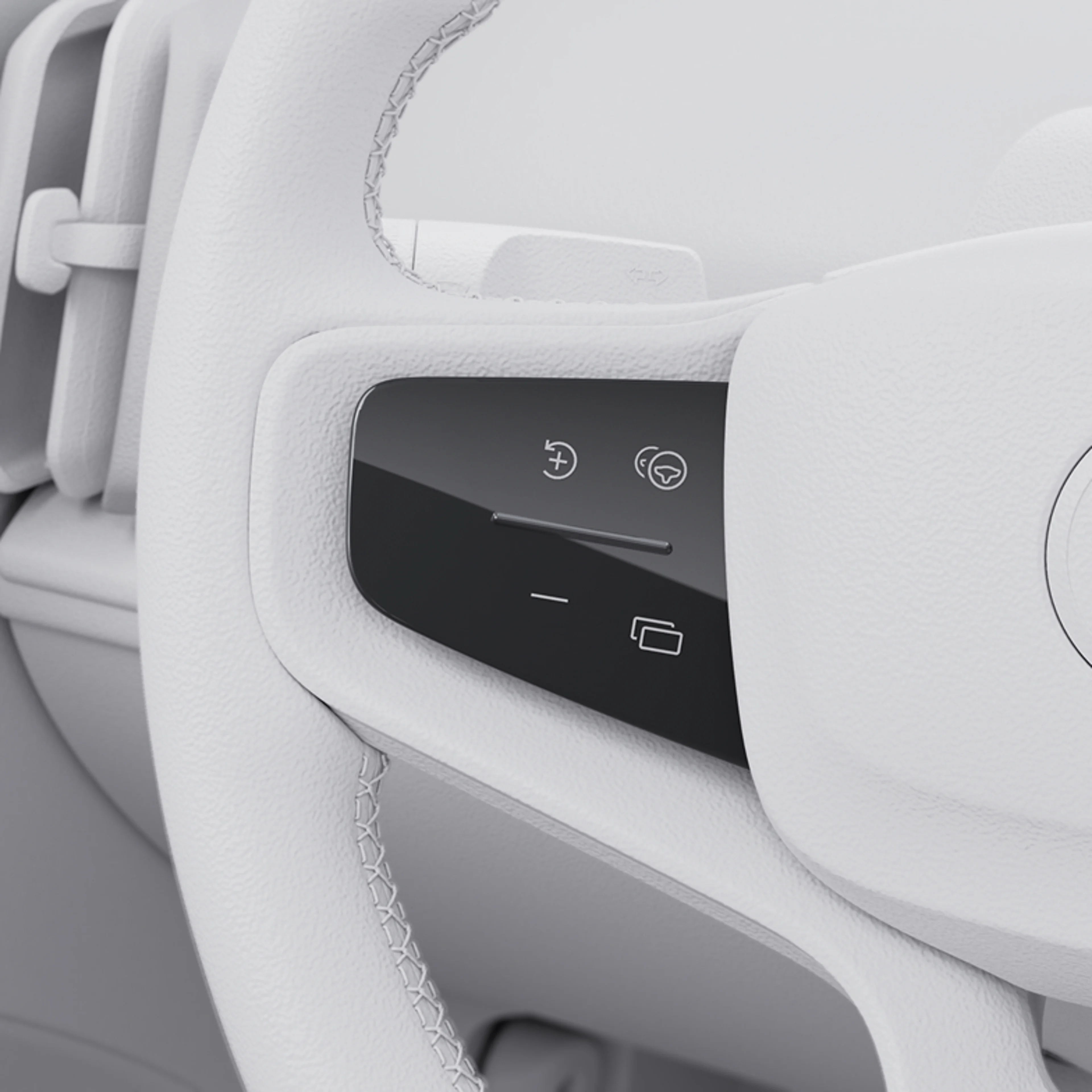 Close-up of a Volvo car's steering wheel with smart control buttons, illustrating the built-in speed cap feature.