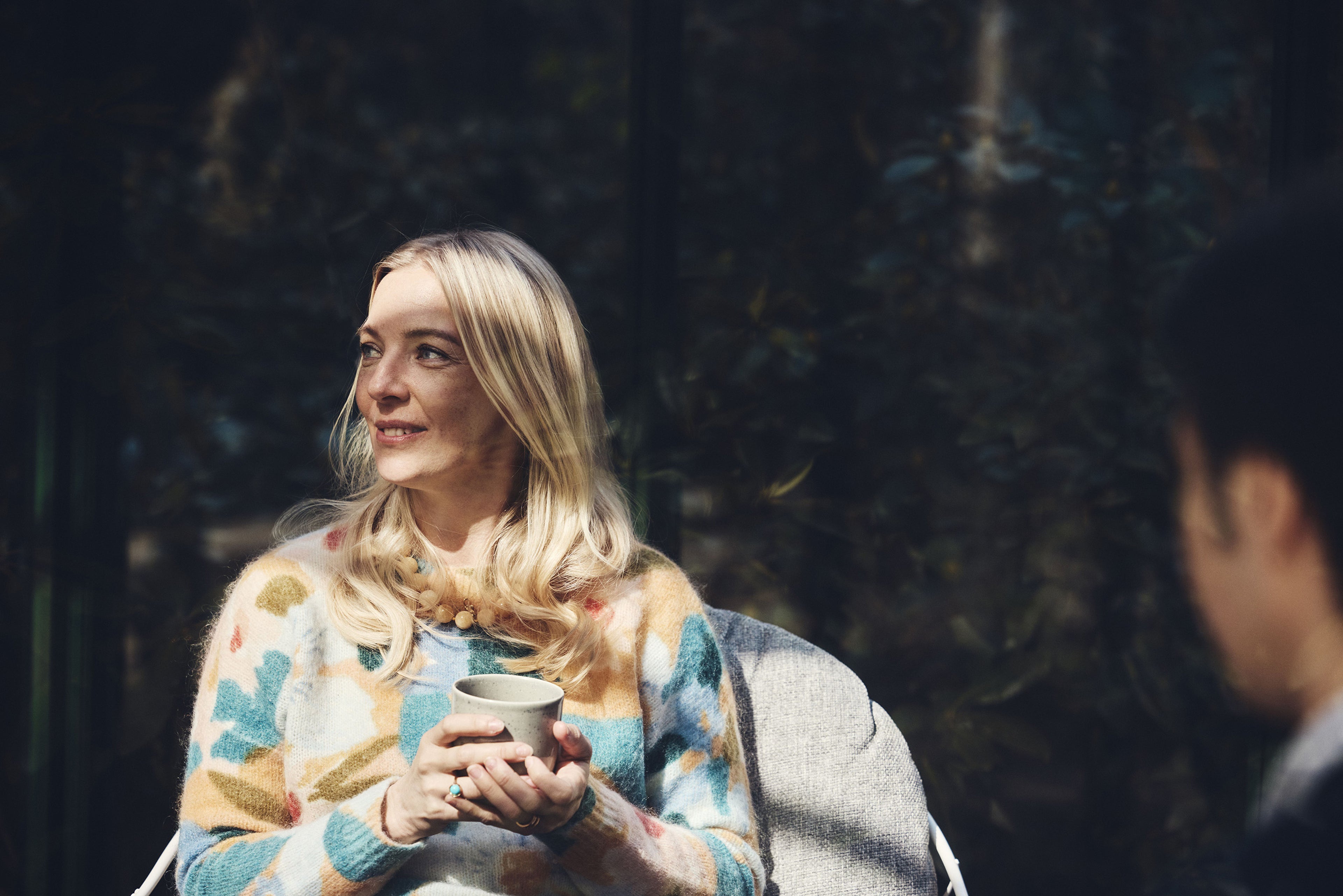 A woman smiling.