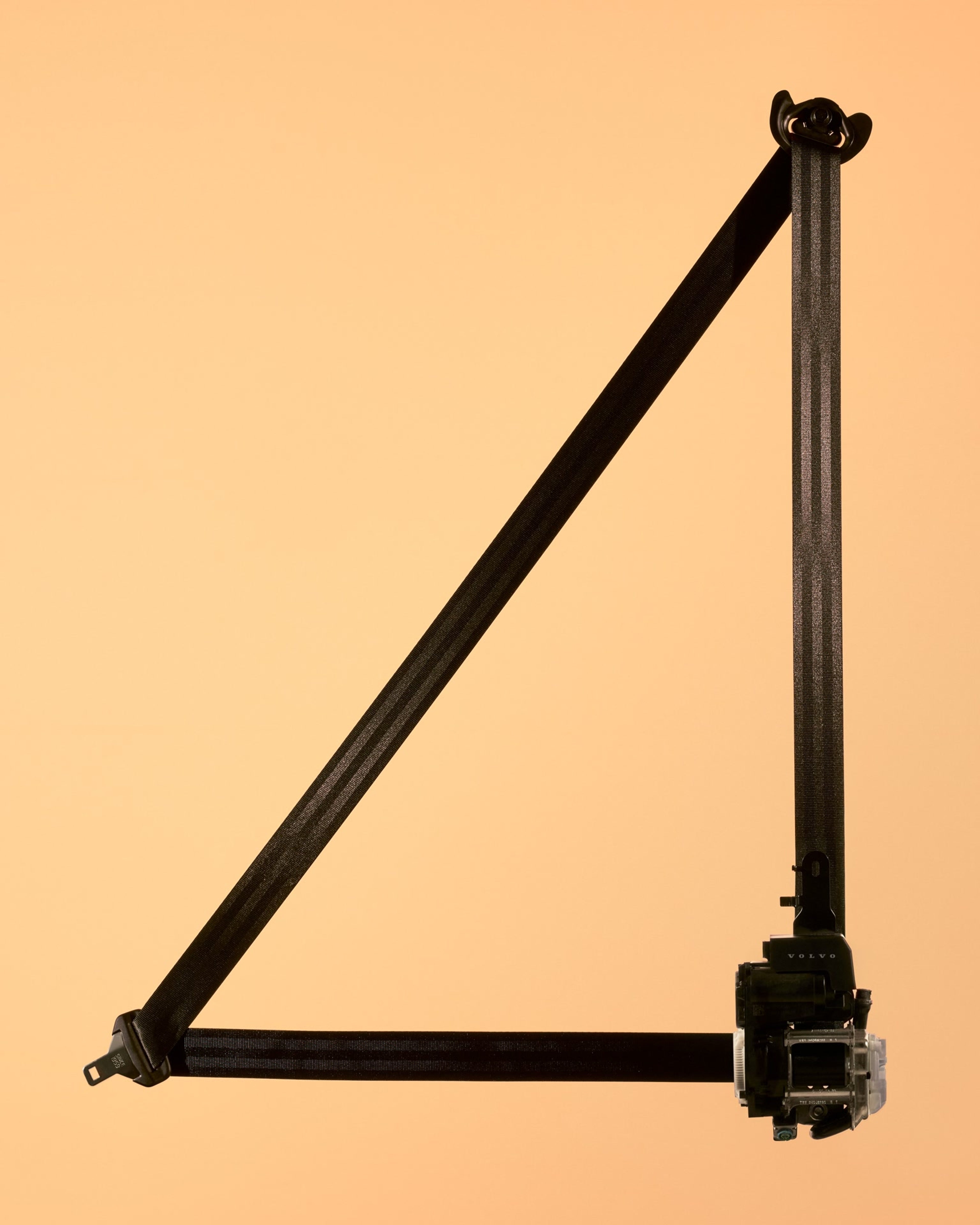 Multi-adaptive safety belt structure shown against an orange background.