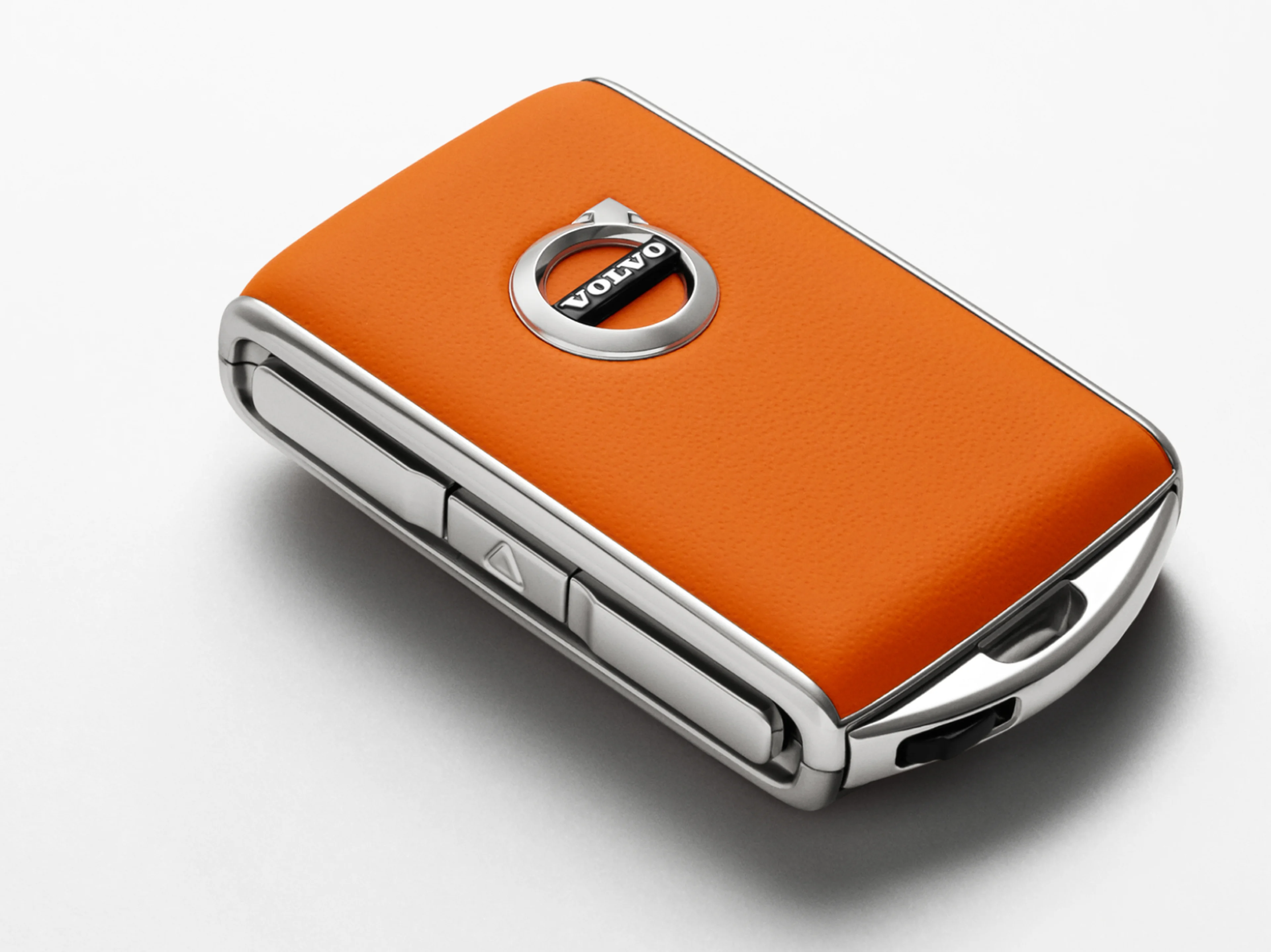 An orange Volvo key fob