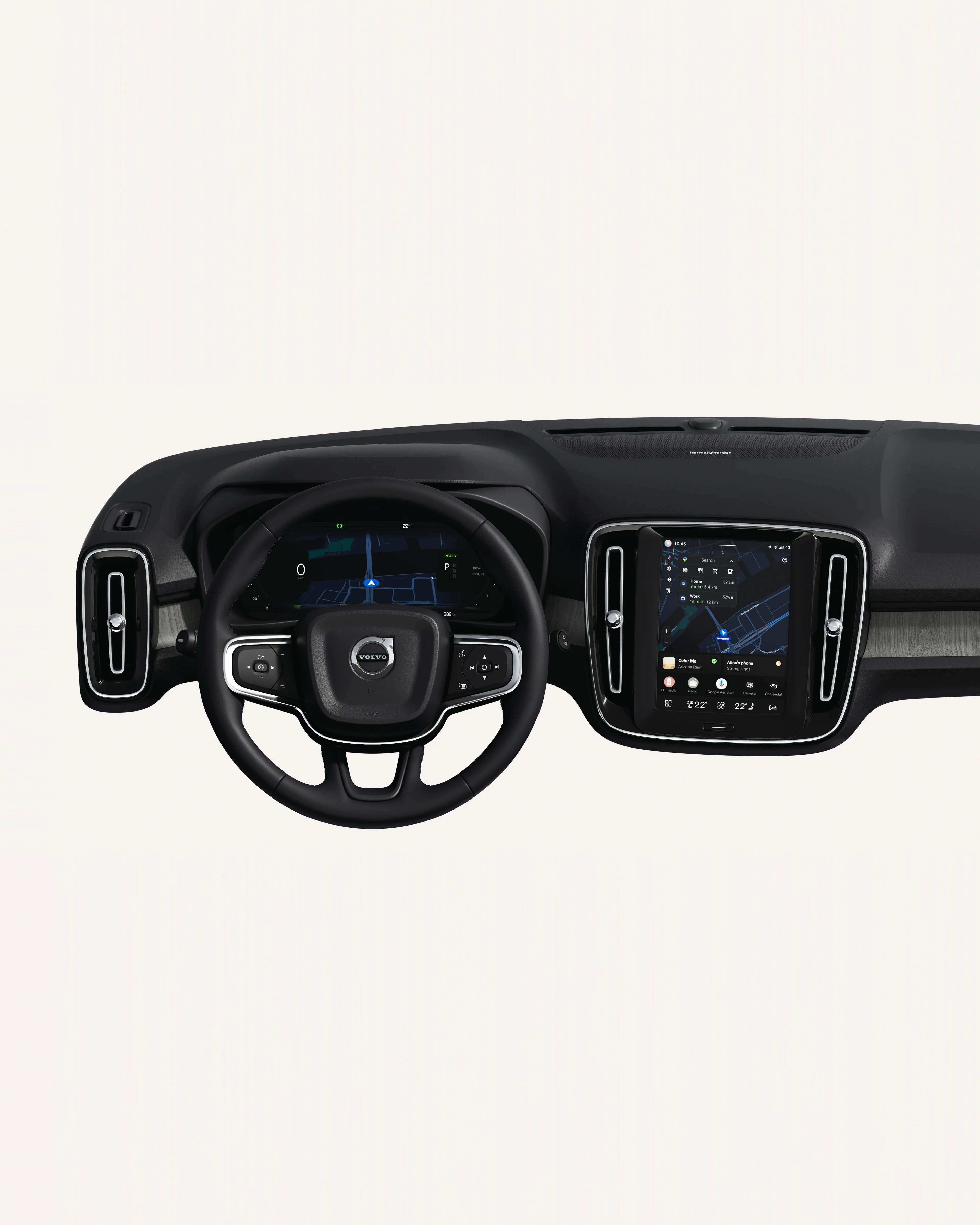 Interior view of the Volvo XC40 dashboard, including steering wheel and touchscreen in a white studio environment.