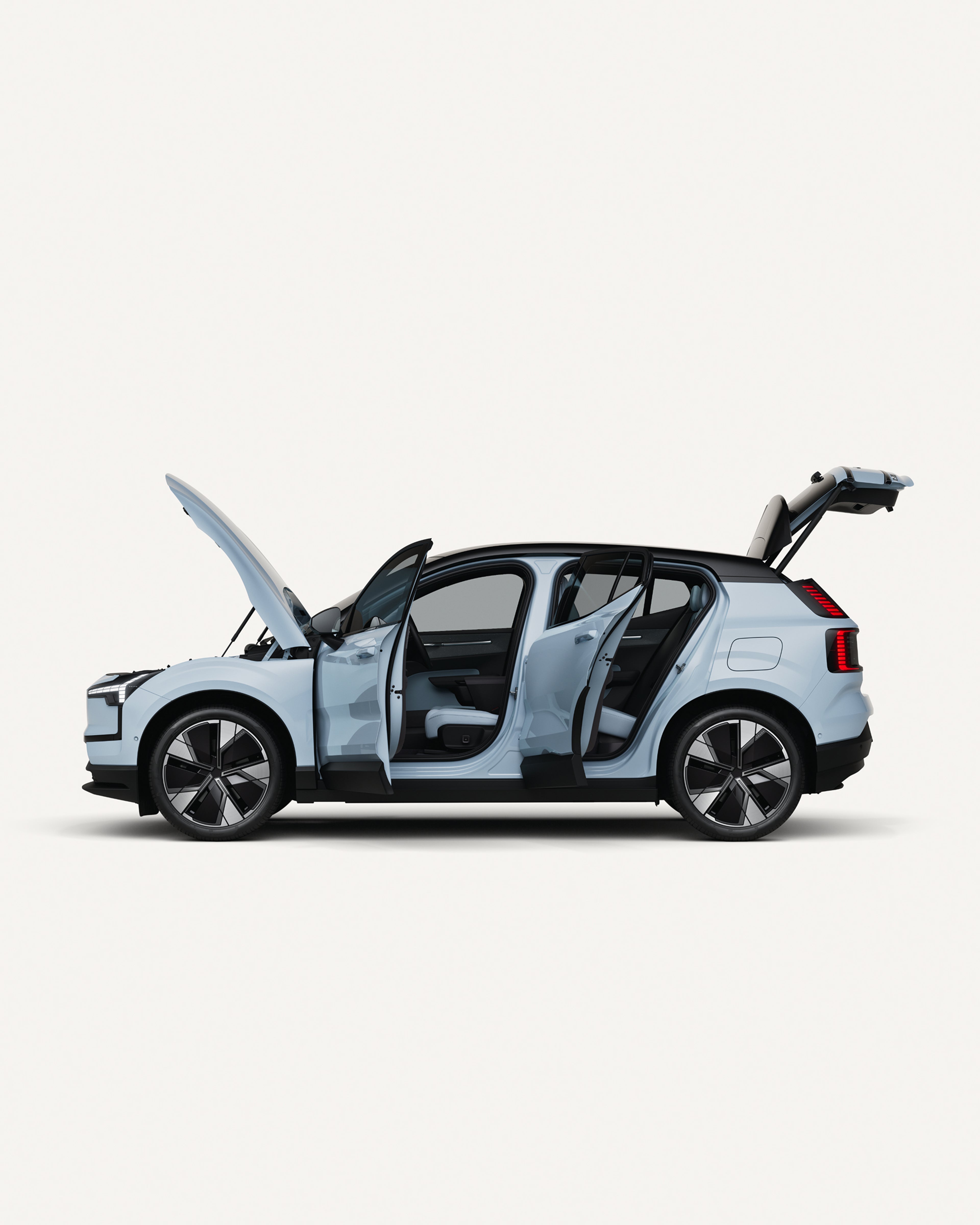 Side view of the fully electric Volvo EX30 with open hood, doors, and trunk.