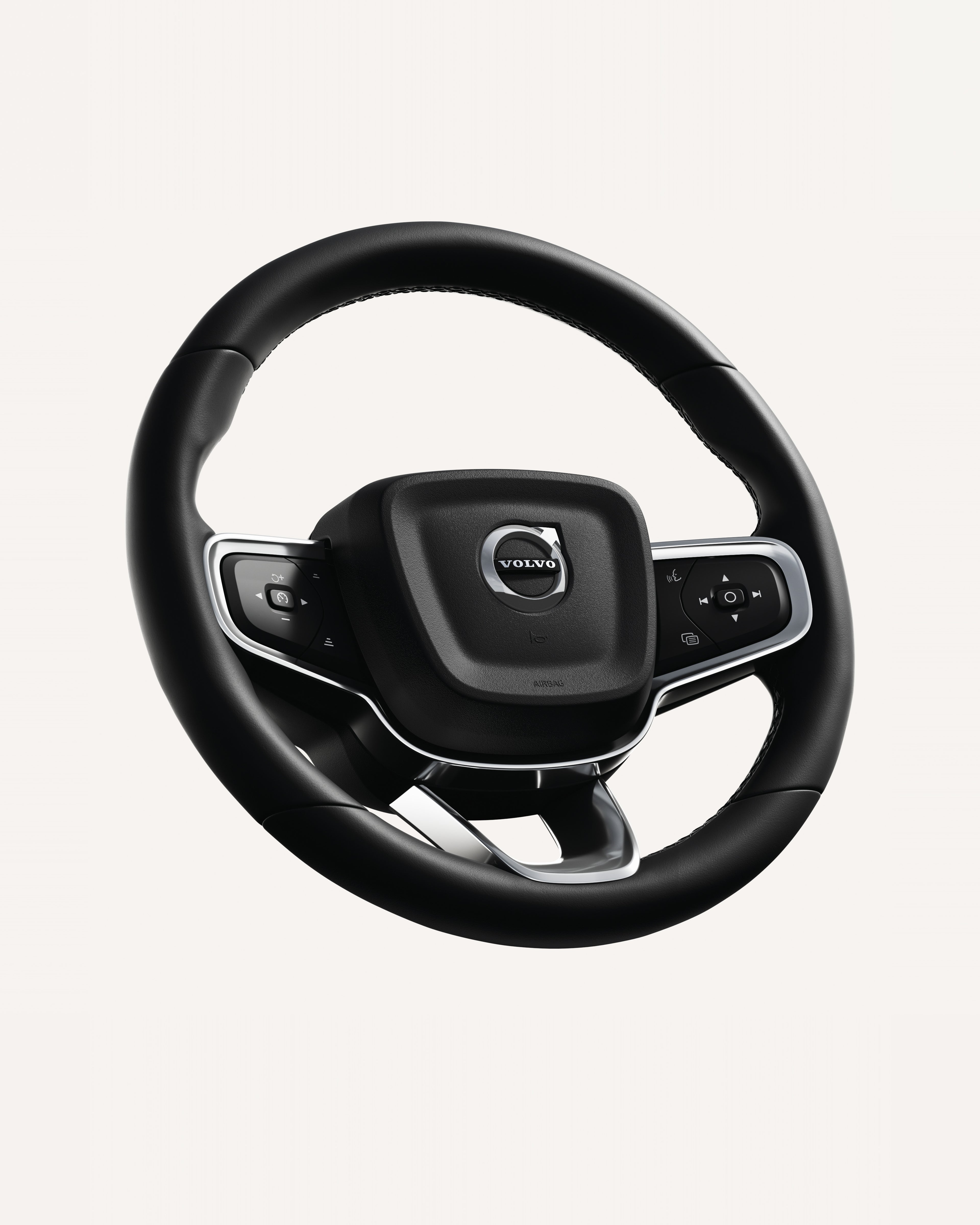 Close-up of the Volvo EX40 steering wheel, featuring integrated controls.
