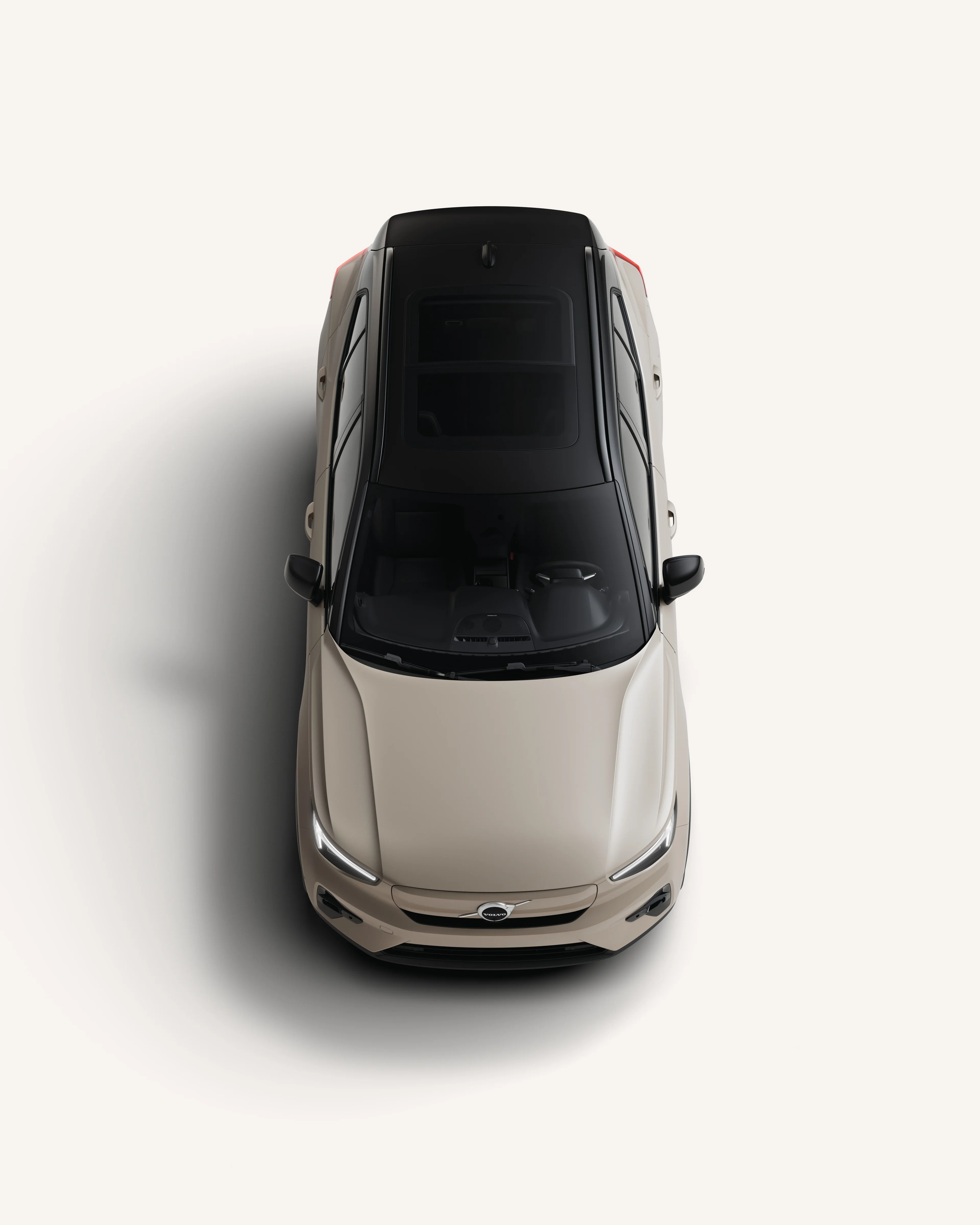 Top-down view of the Volvo EX40 showcasing its roof in a white studio environment.