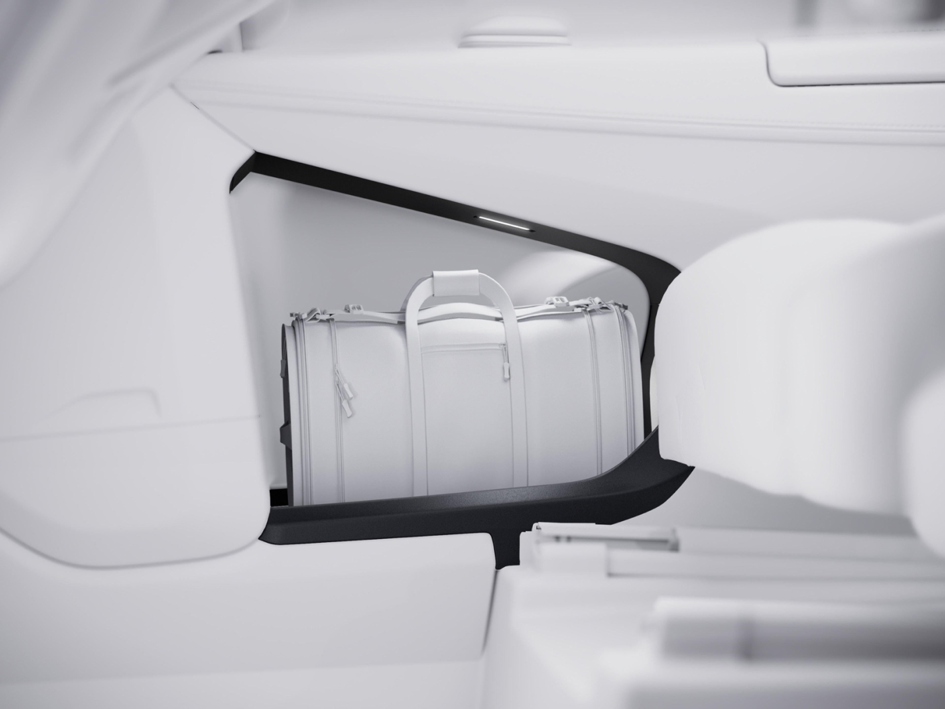 Image of the large storage space carved into the rear passenger door of the Volvo EM90.