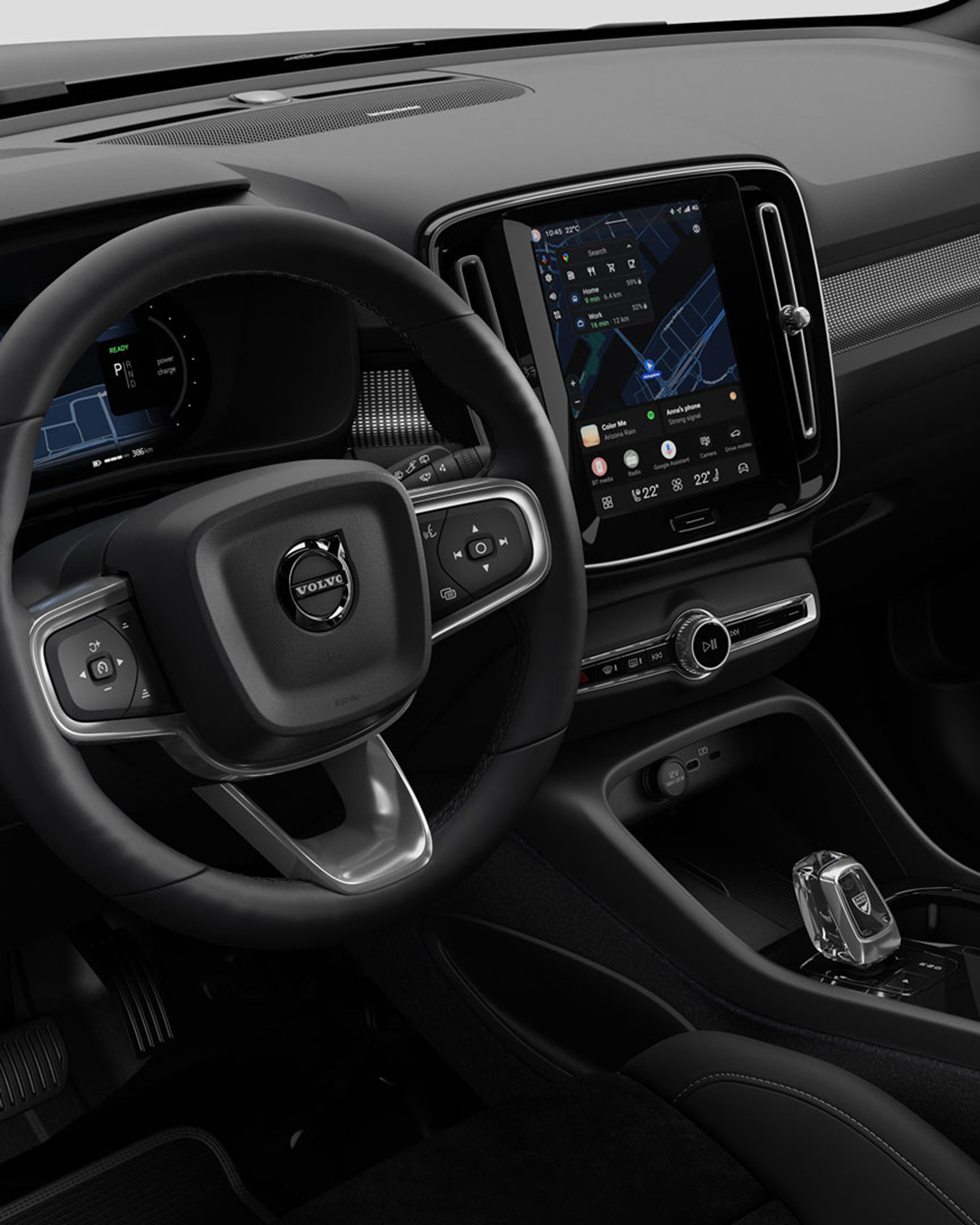 Interior of the Volvo EC40 with the steering wheel and central touchscreen display.