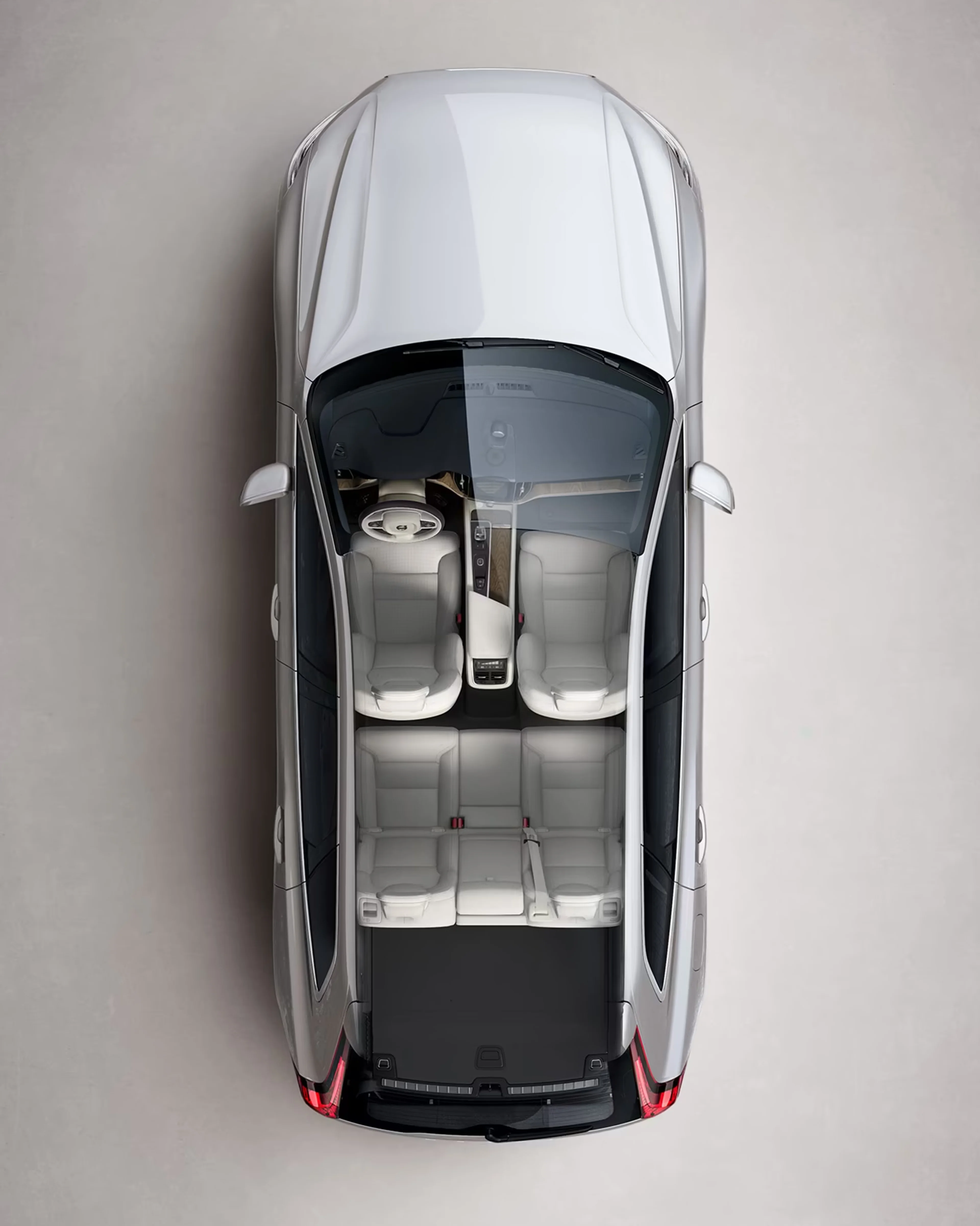 A silver Volvo XC60 seen from directly above with interior visible.