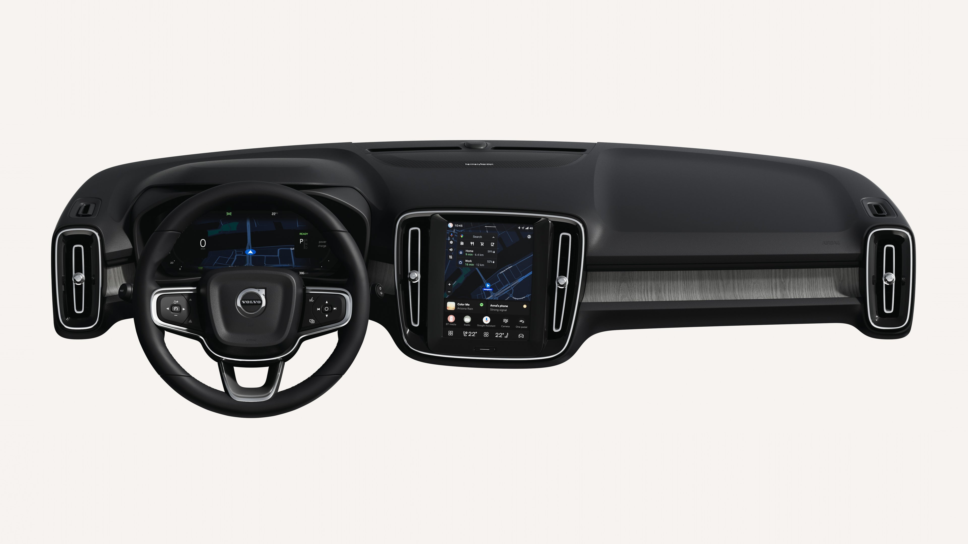 Interior view of the Volvo EC40 dashboard, including steering wheel and touchscreen.