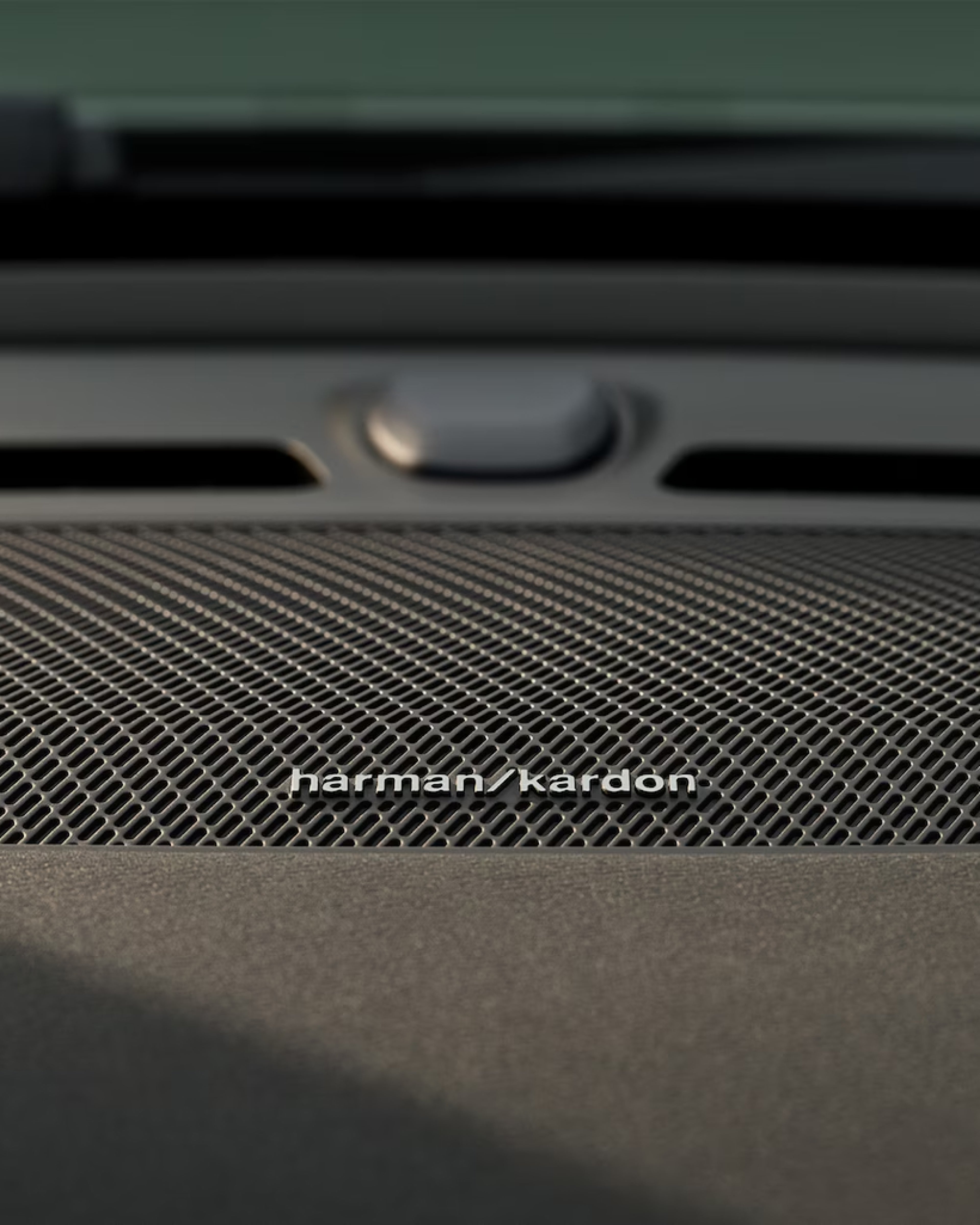 Detail image of Harman Kardon speaker in a Volvo XC40 Recharge door.