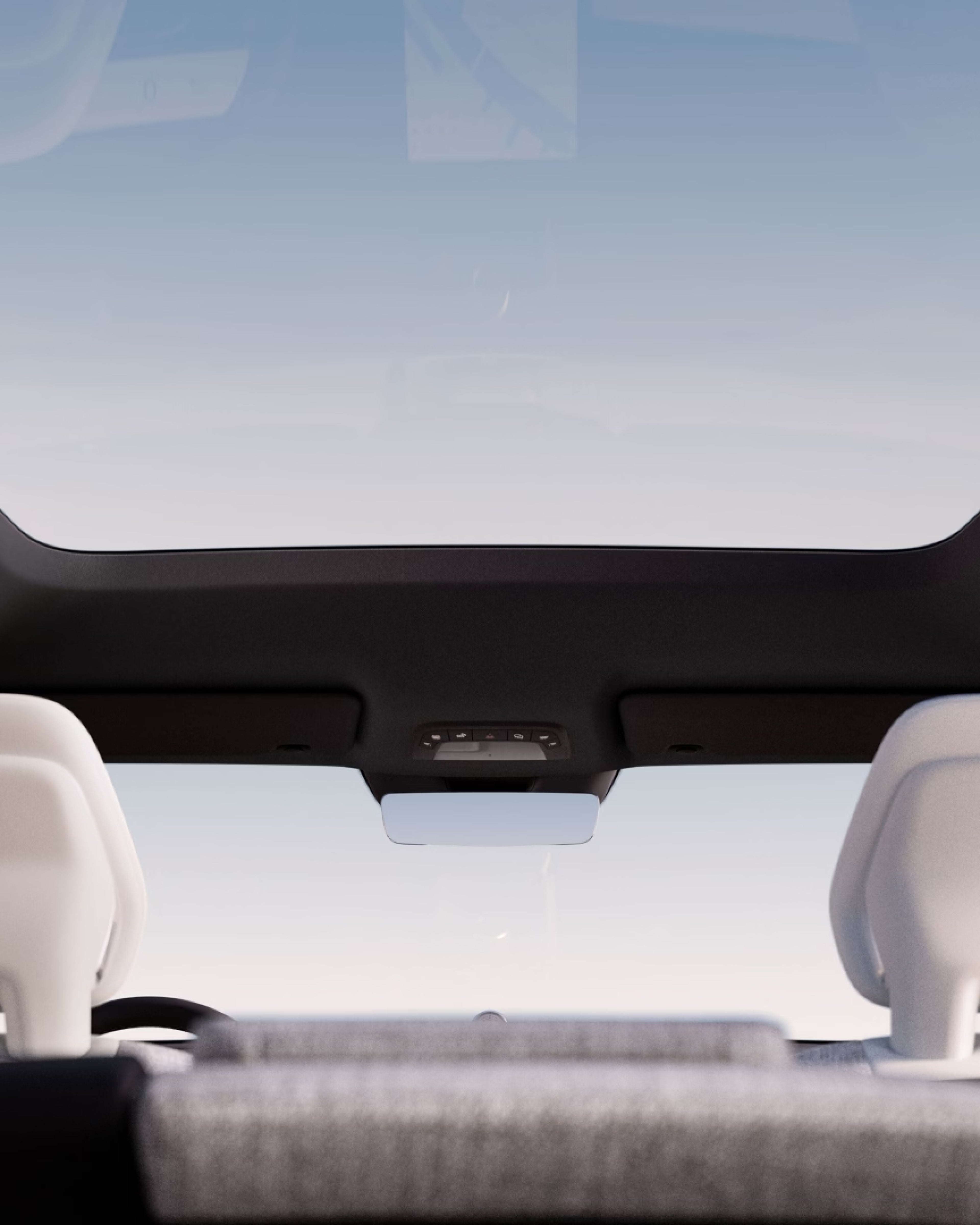 A low-angle shot of the panoramic sunroof from inside the EX90.