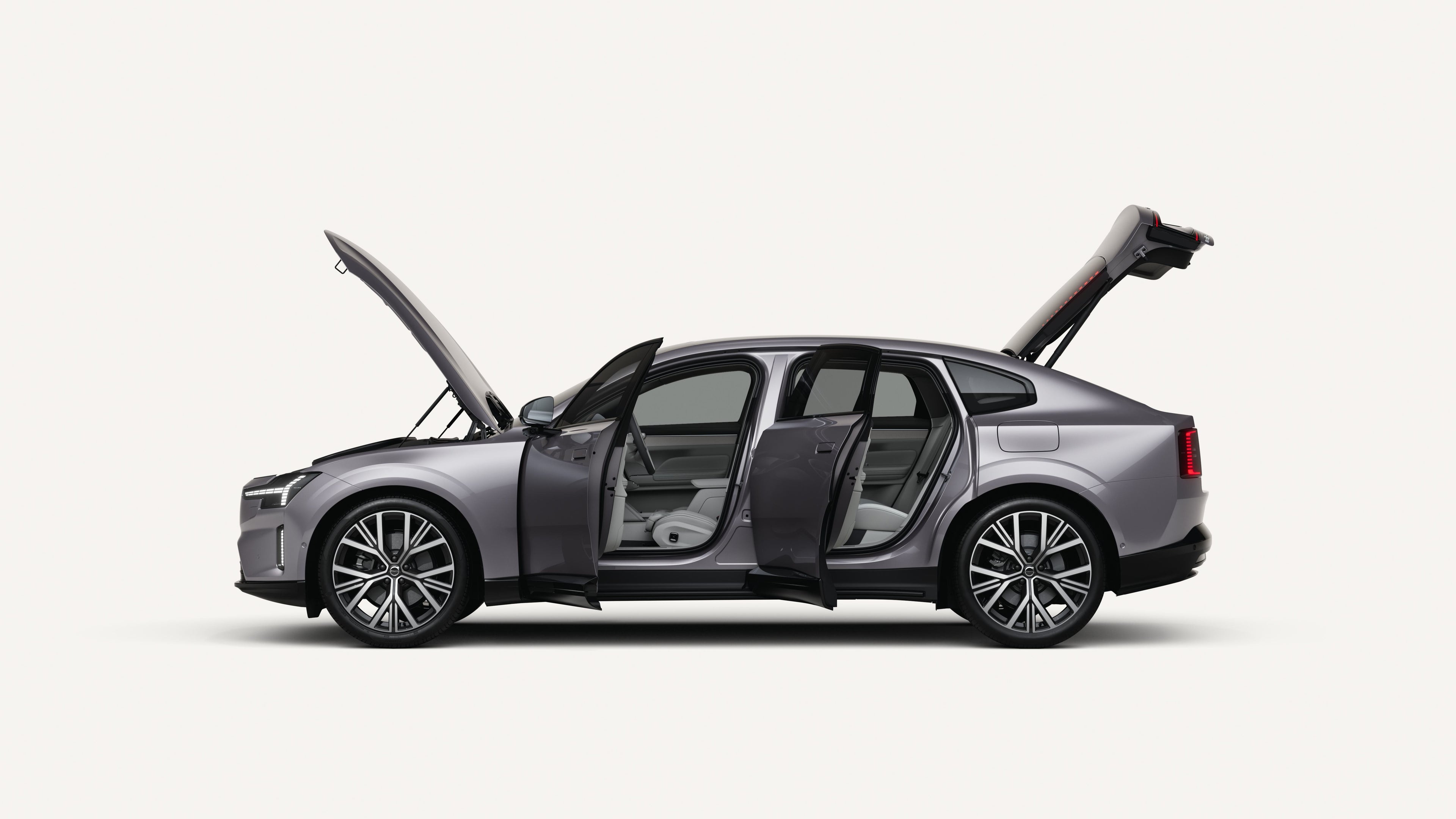 Side view of the Volvo ES90 electric with open hood, doors, and trunk in a white studio environment.