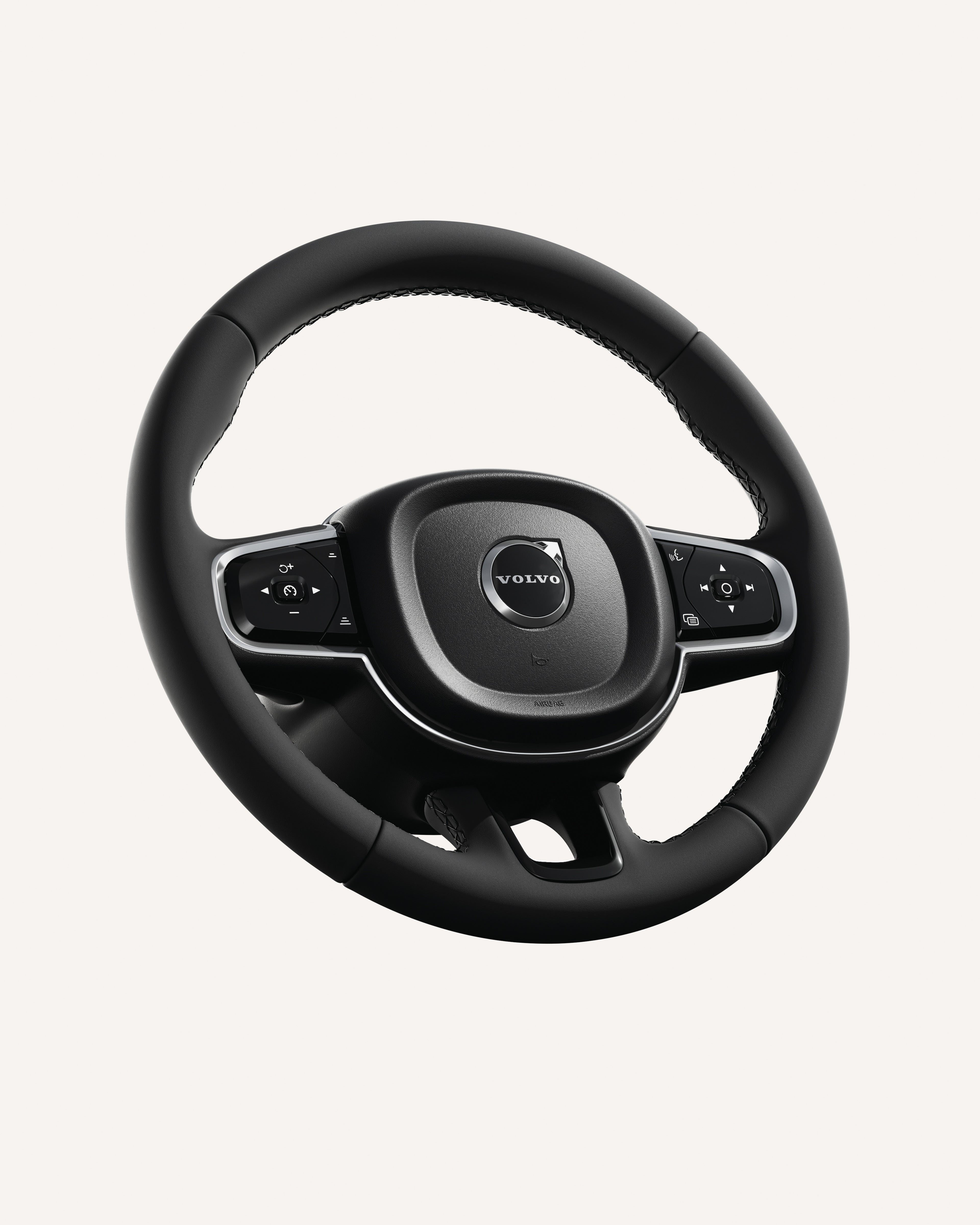 Close-up of the Volvo XC90 steering wheel, featuring integrated controls