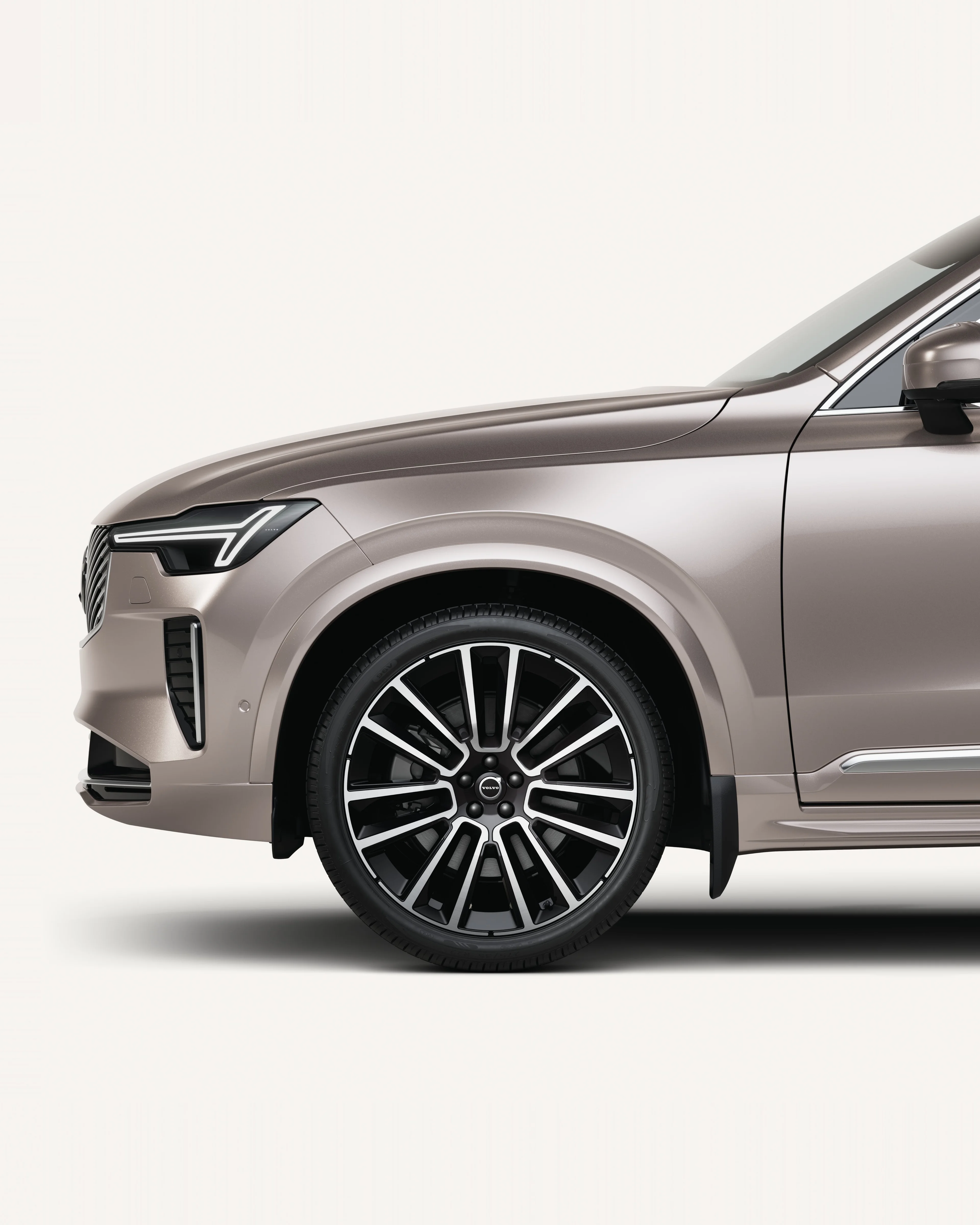 Front half of the Volvo XC90 in a white studio environment.