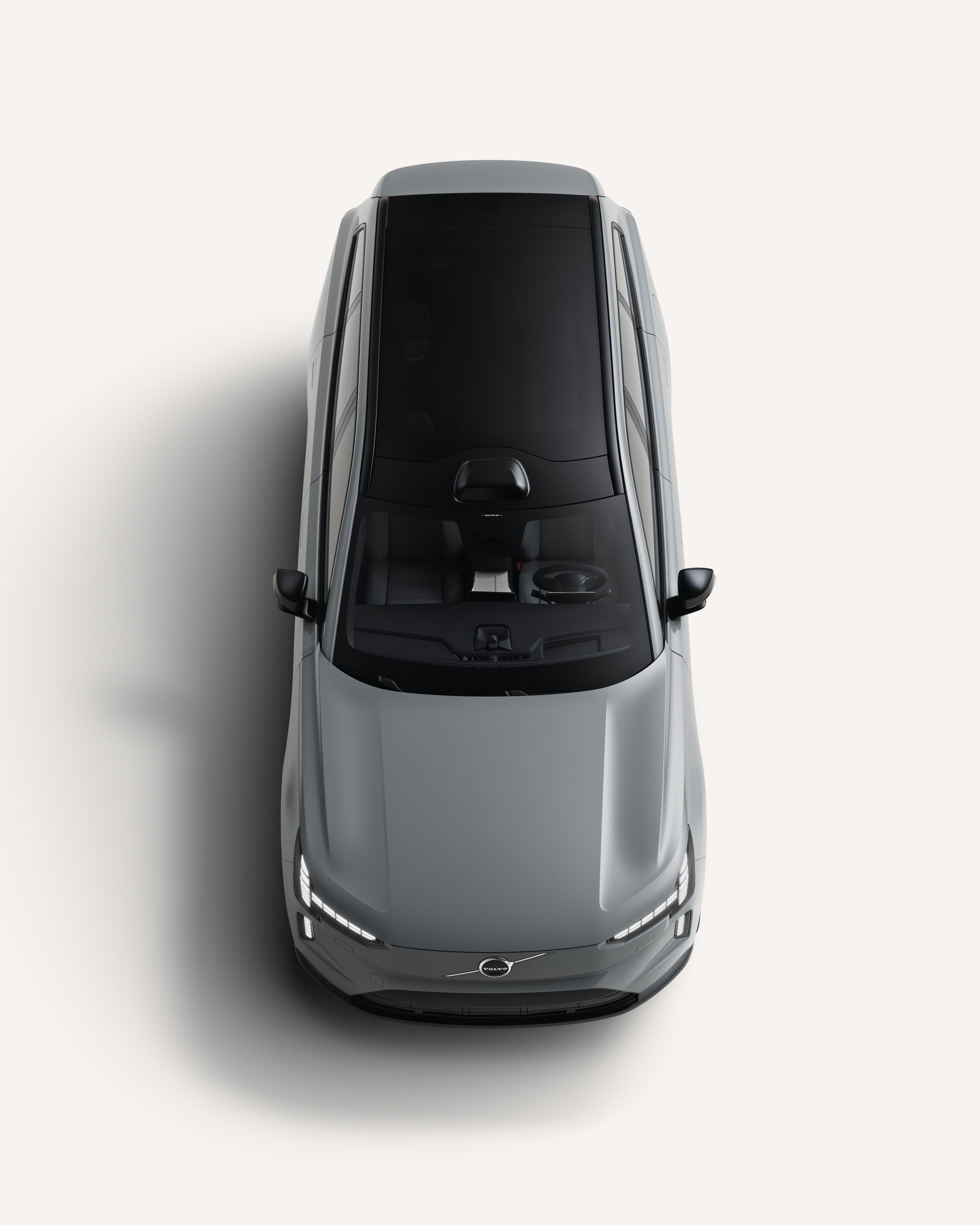 Vue du haut du Volvo EX90 montrant son toit dans un studio blanc.