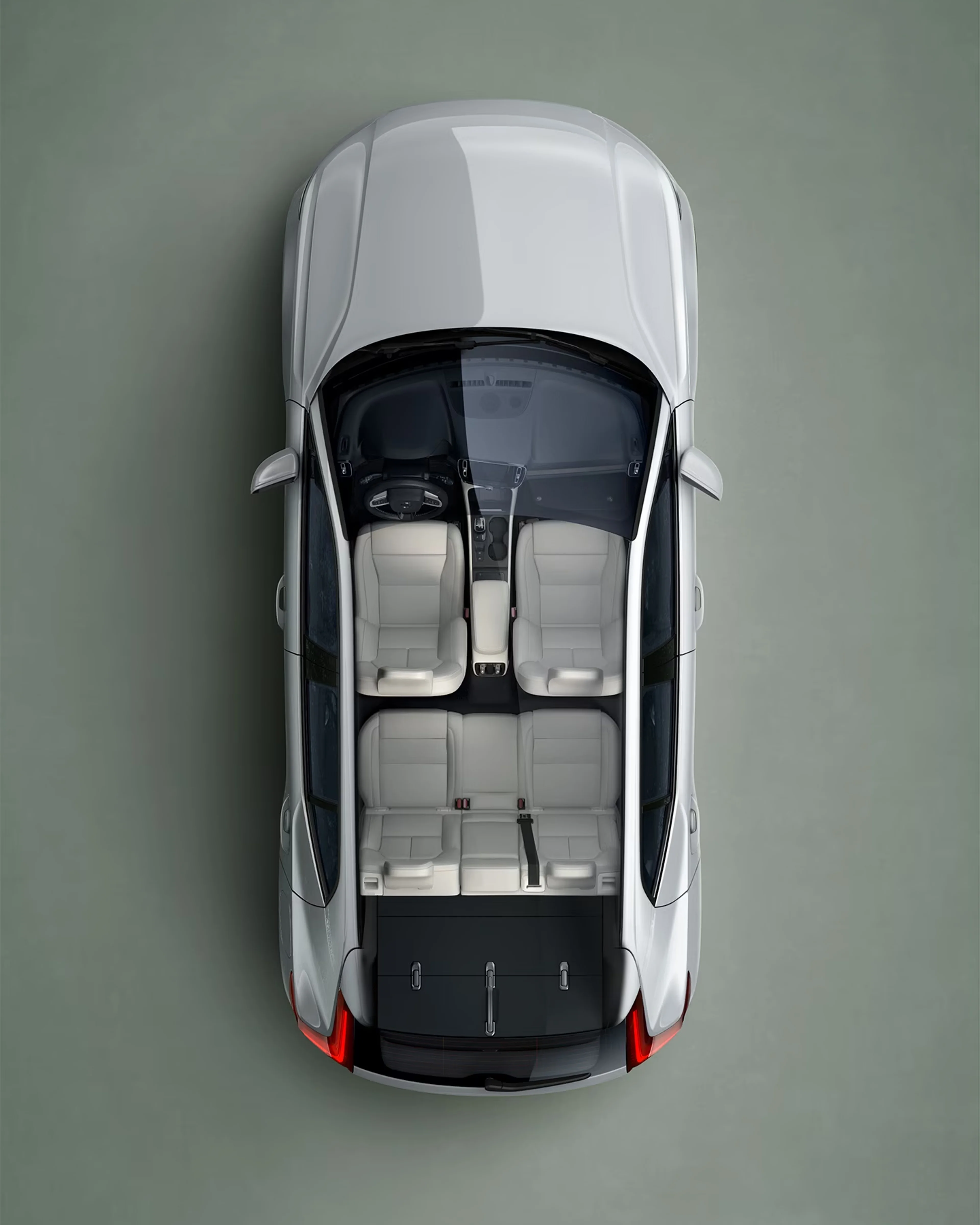 A white Volvo XC40 SUV seen from directly above with interior visible.
