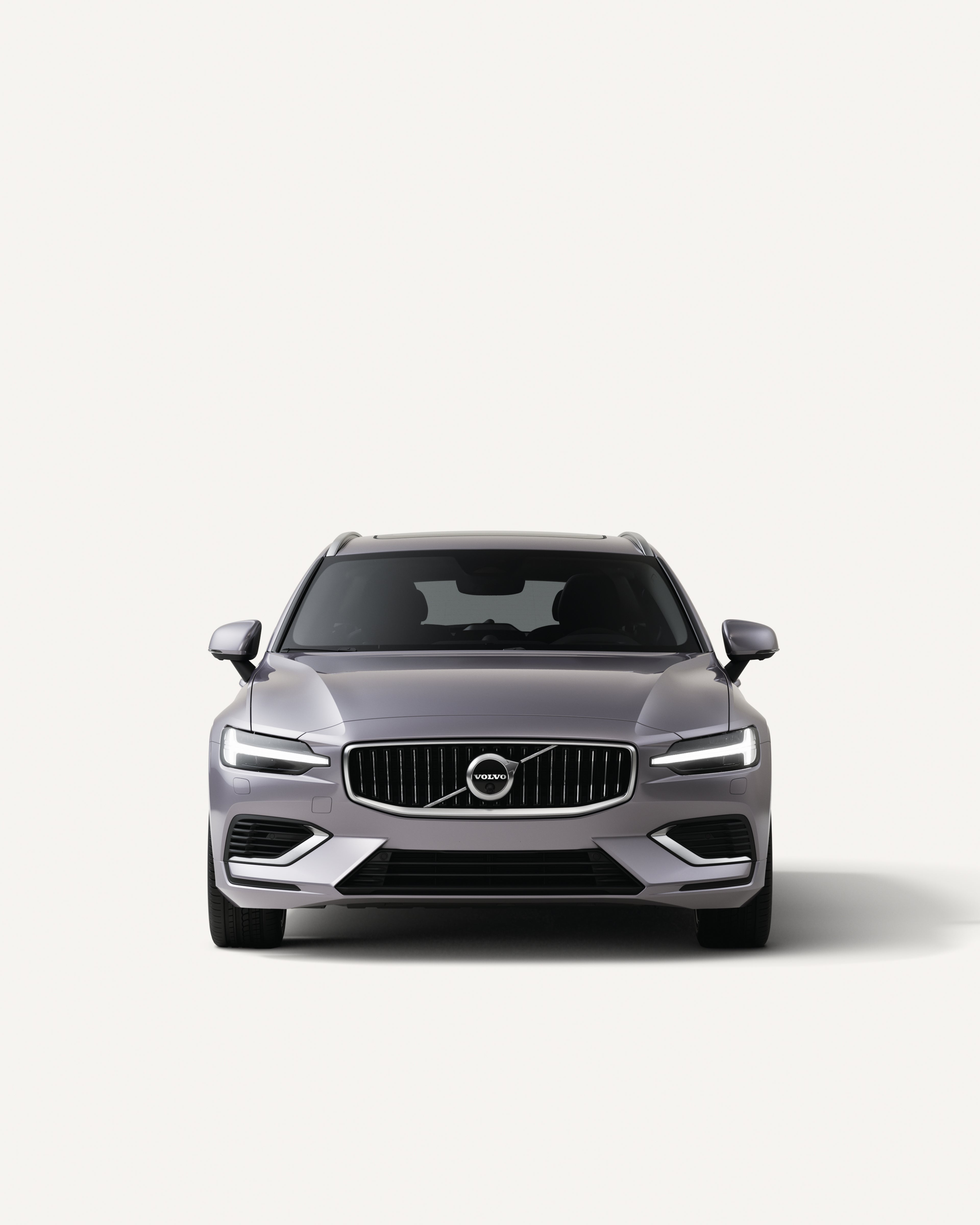 Front view of the Volvo V60 in a white studio environment.