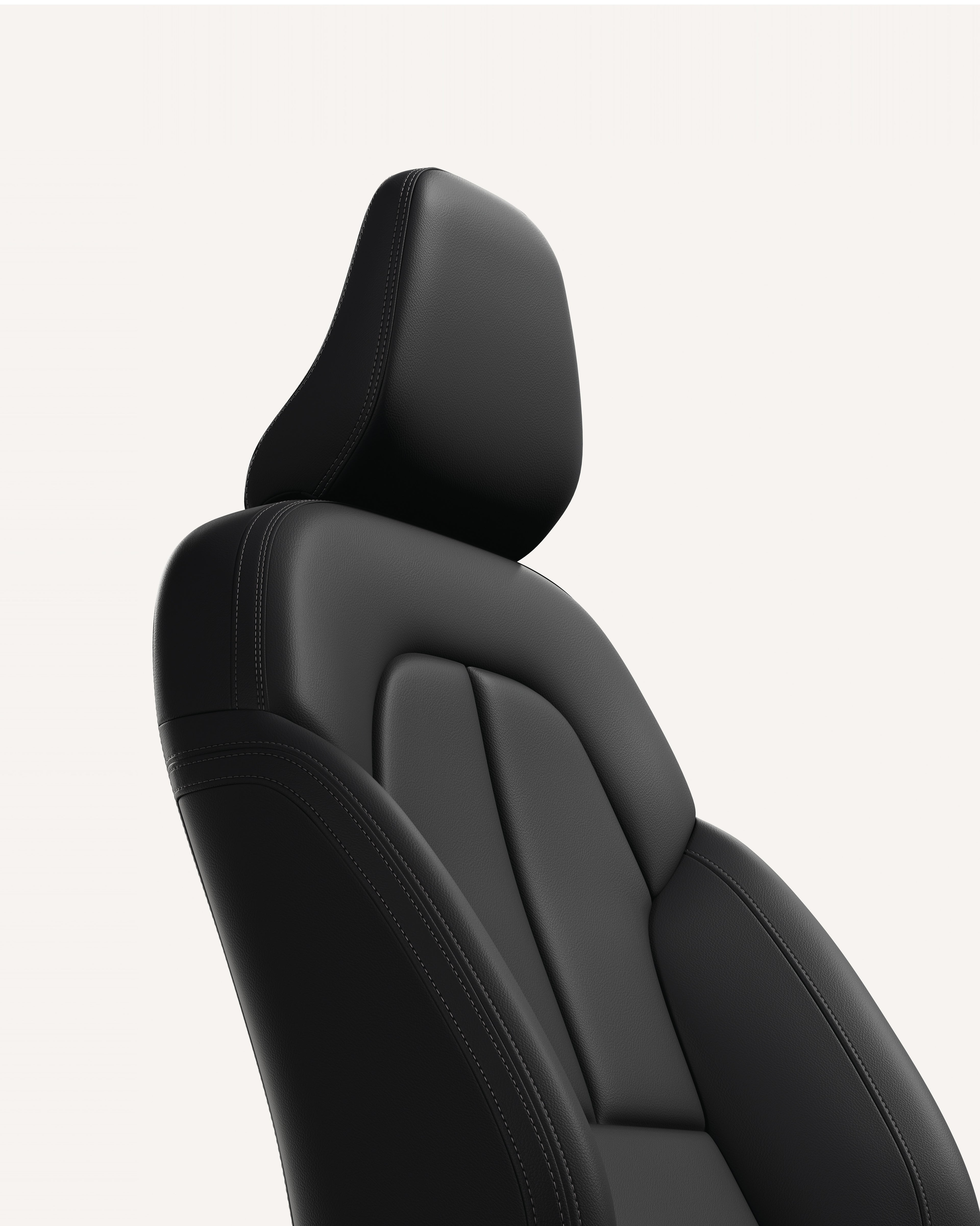 Крупен план на тапацирот на предните седишта во Volvo XC40 во бела студиска средина.