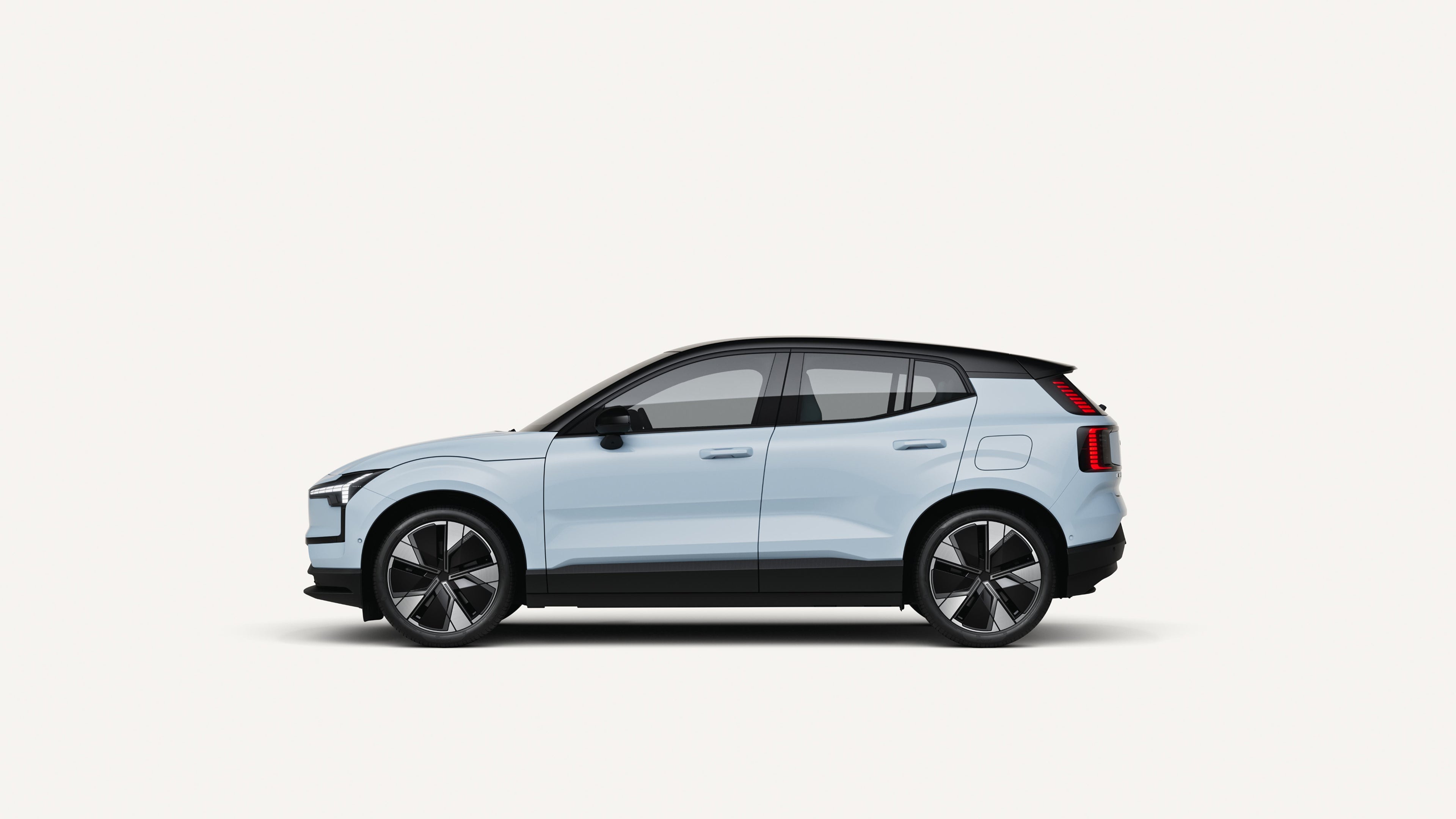 Side view of the Volvo EX30 electric in a white studio environment.