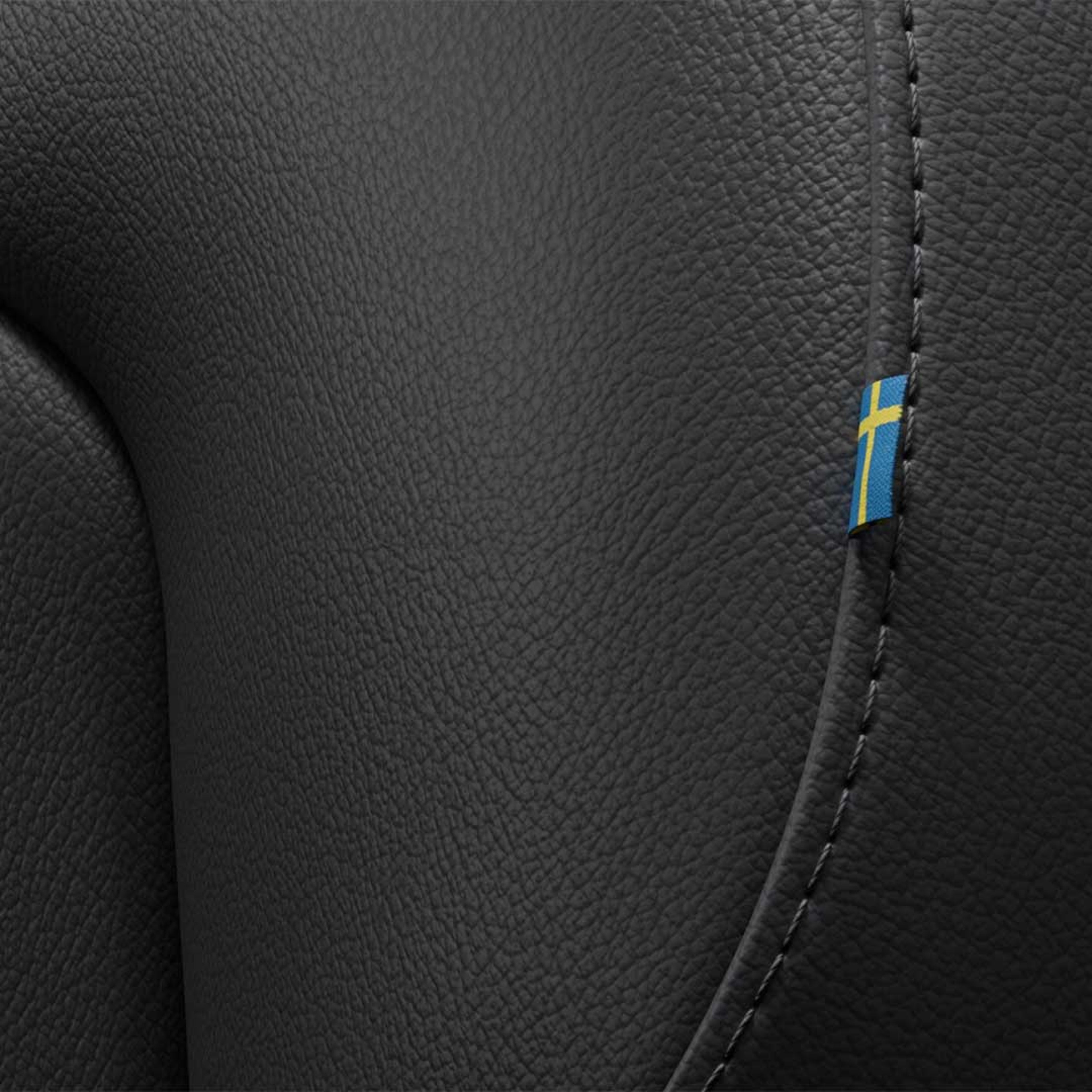 Close-up of the stitching on the Volvo S60 mild hybrid’s front passenger seat featuring a tiny Swedish flag.