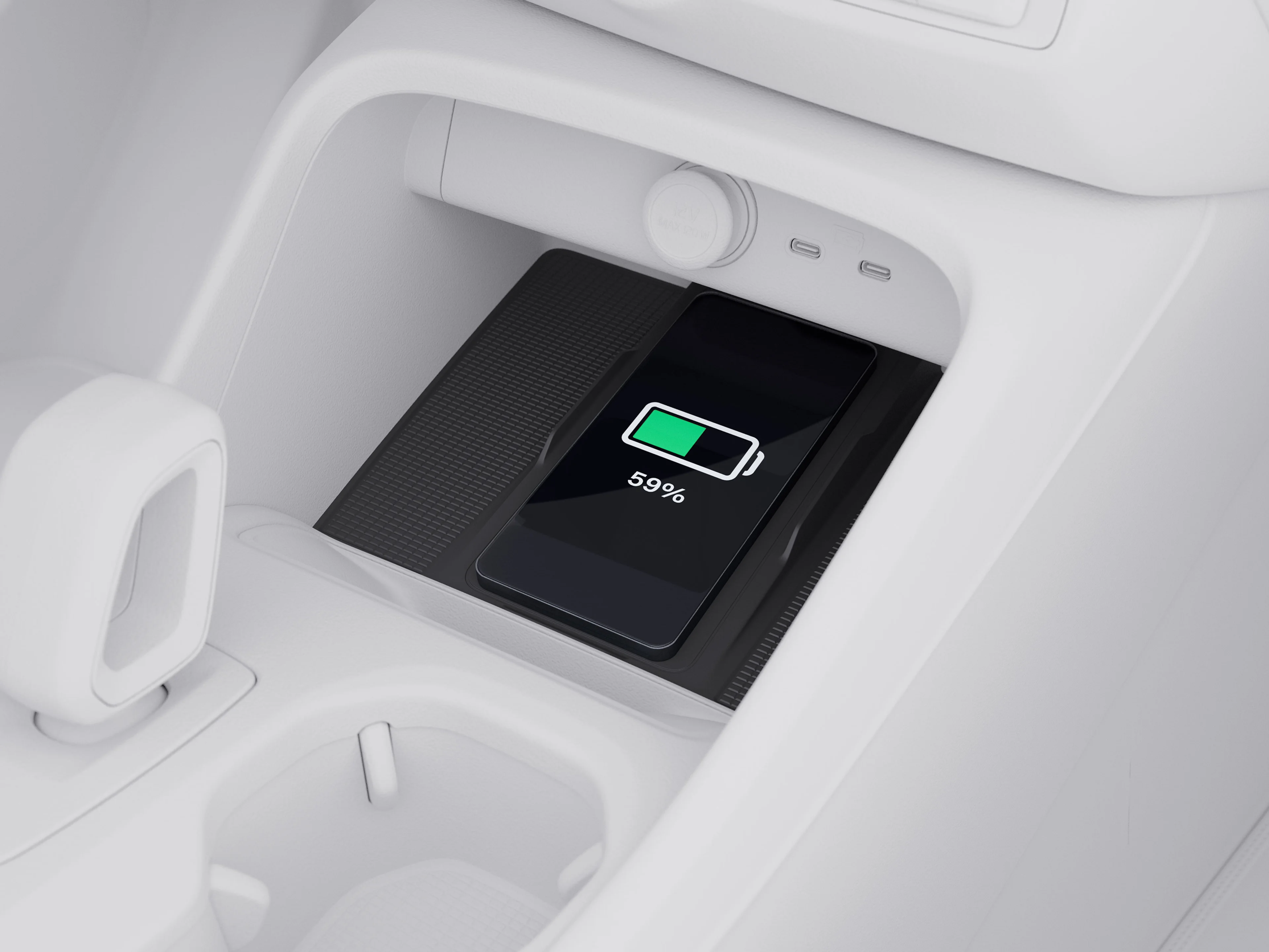 Top view illustration of the center console highlighting the charging pad in a Volvo XC40.