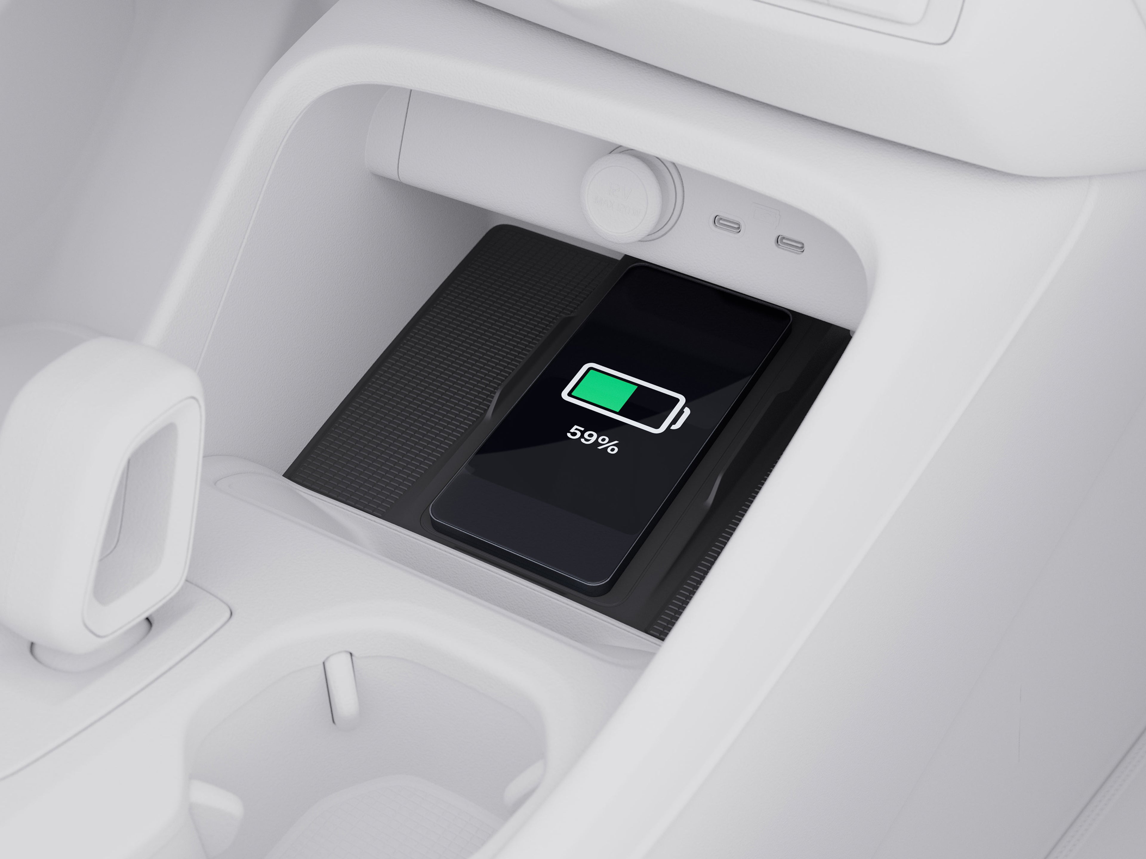 Top view illustration of the center console highlighting the charging pad in a Volvo XC40.