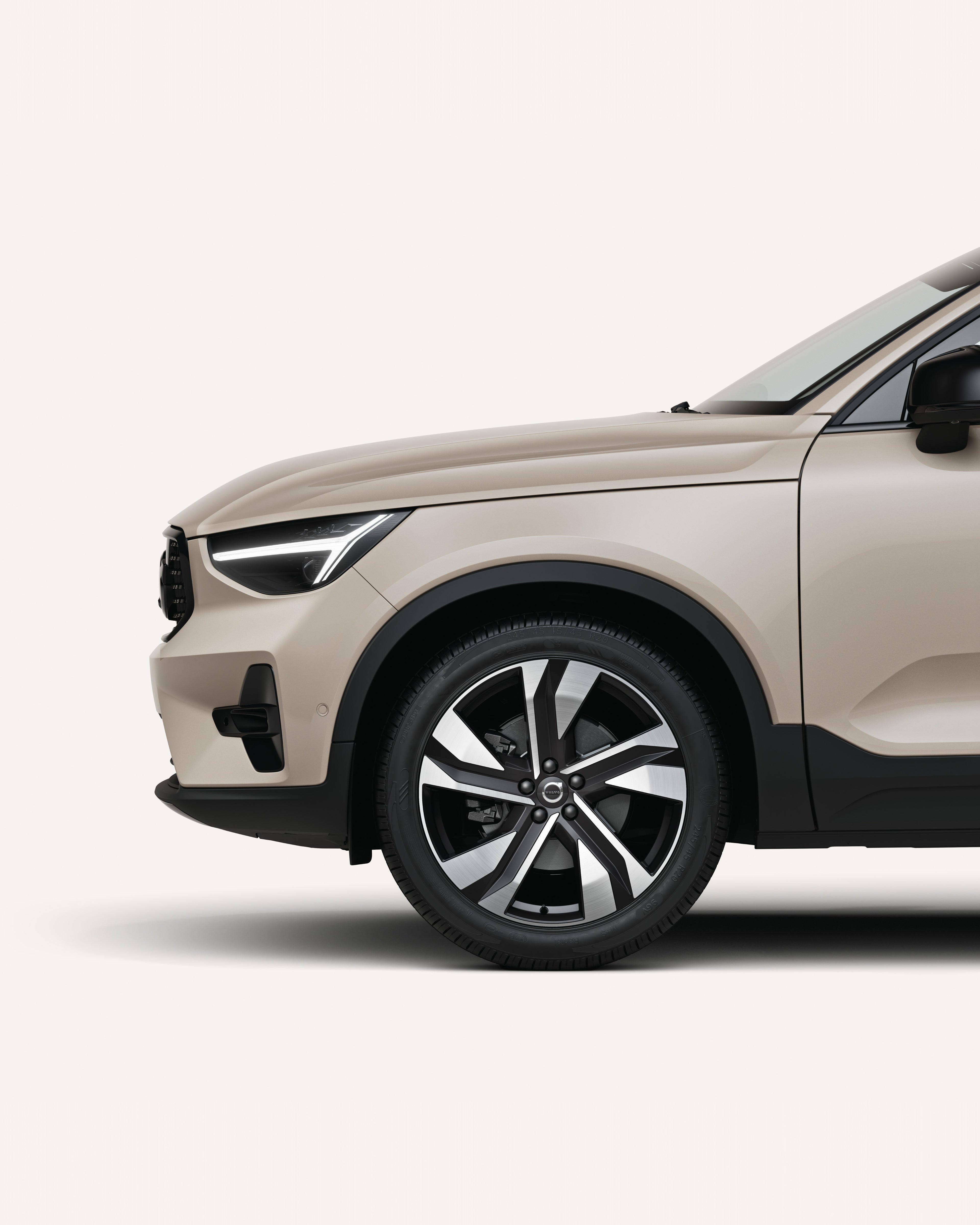 Front half of the Volvo XC40 in a white studio environment.