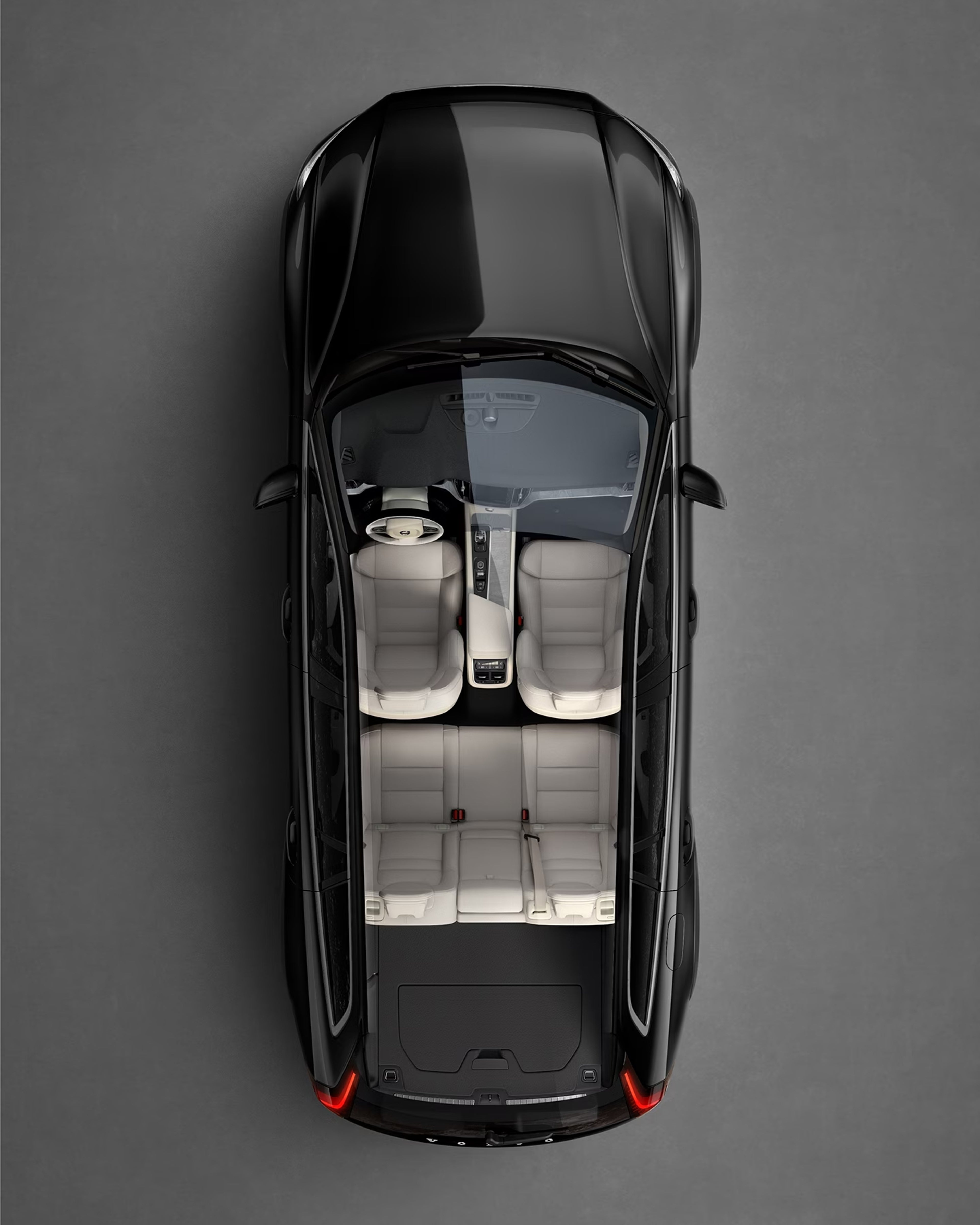 A black Volvo V60 cross country seen from directly above with interior visible