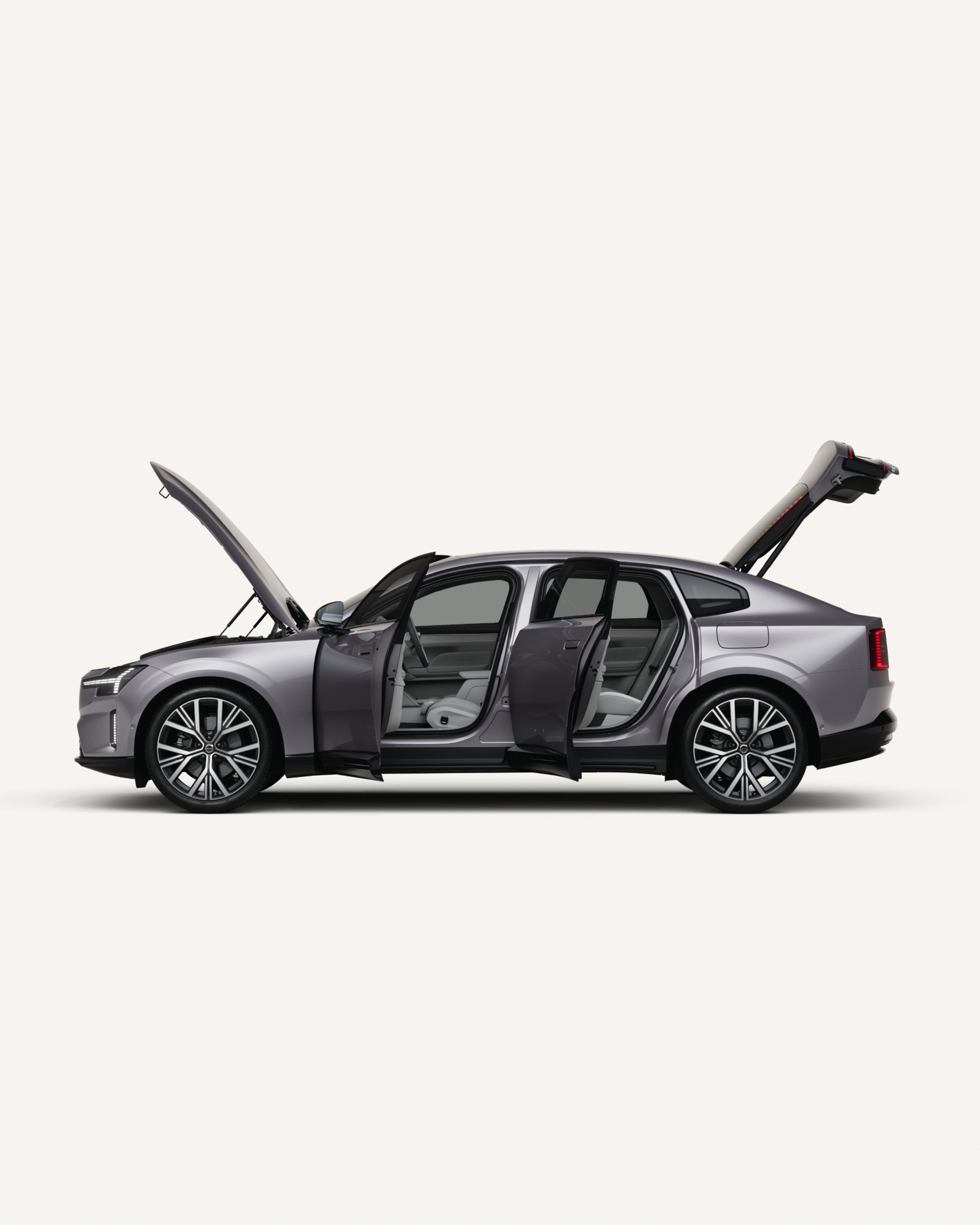 Vista laterale di Volvo ES90 100% elettrica con cofano, portiere e bagagliaio aperti.
