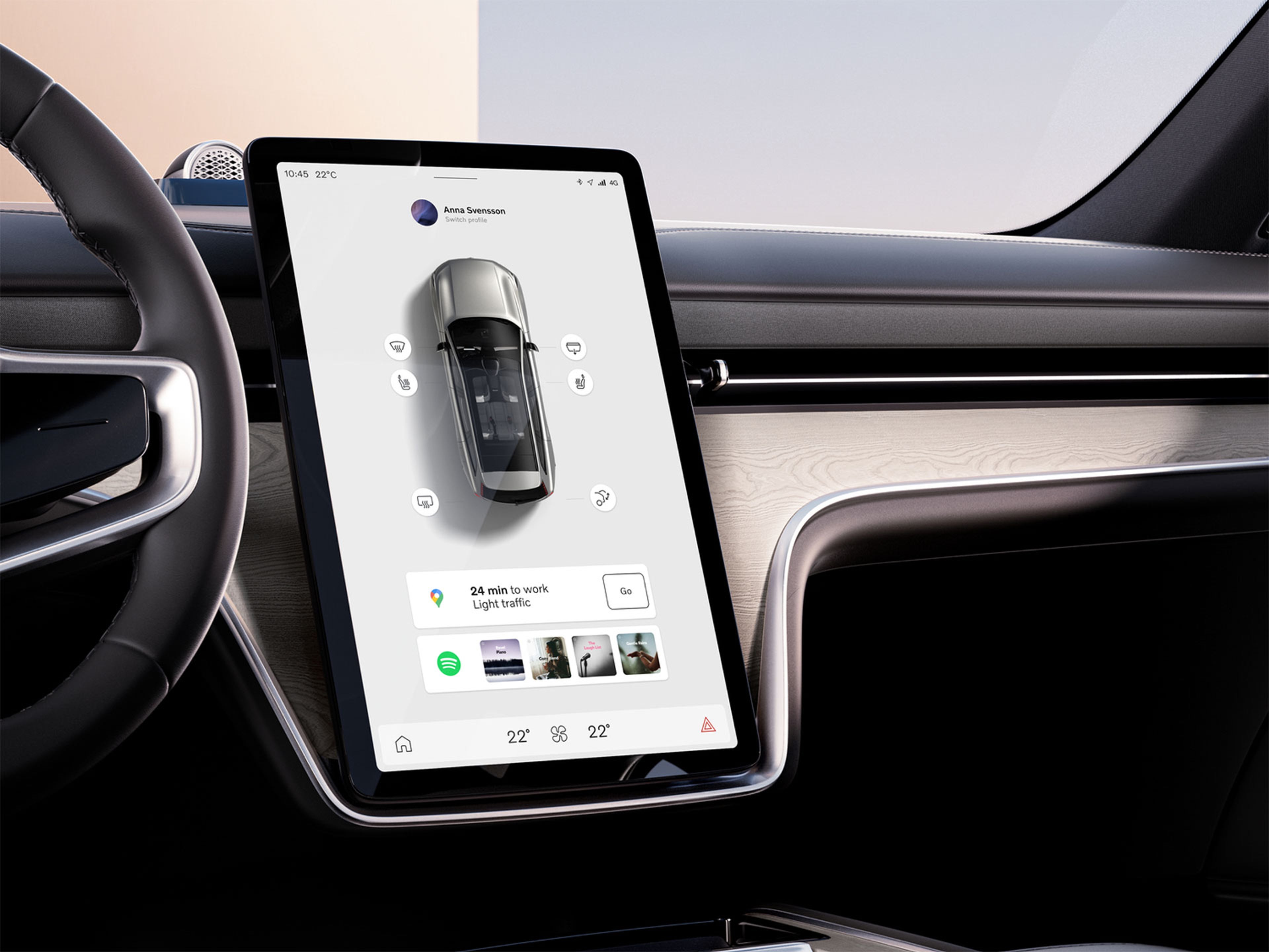 Un primer plano de la pantalla central táctil vista desde el asiento del conductor, que muestra una vista aérea de un Volvo EX90 rodeado de widgets.