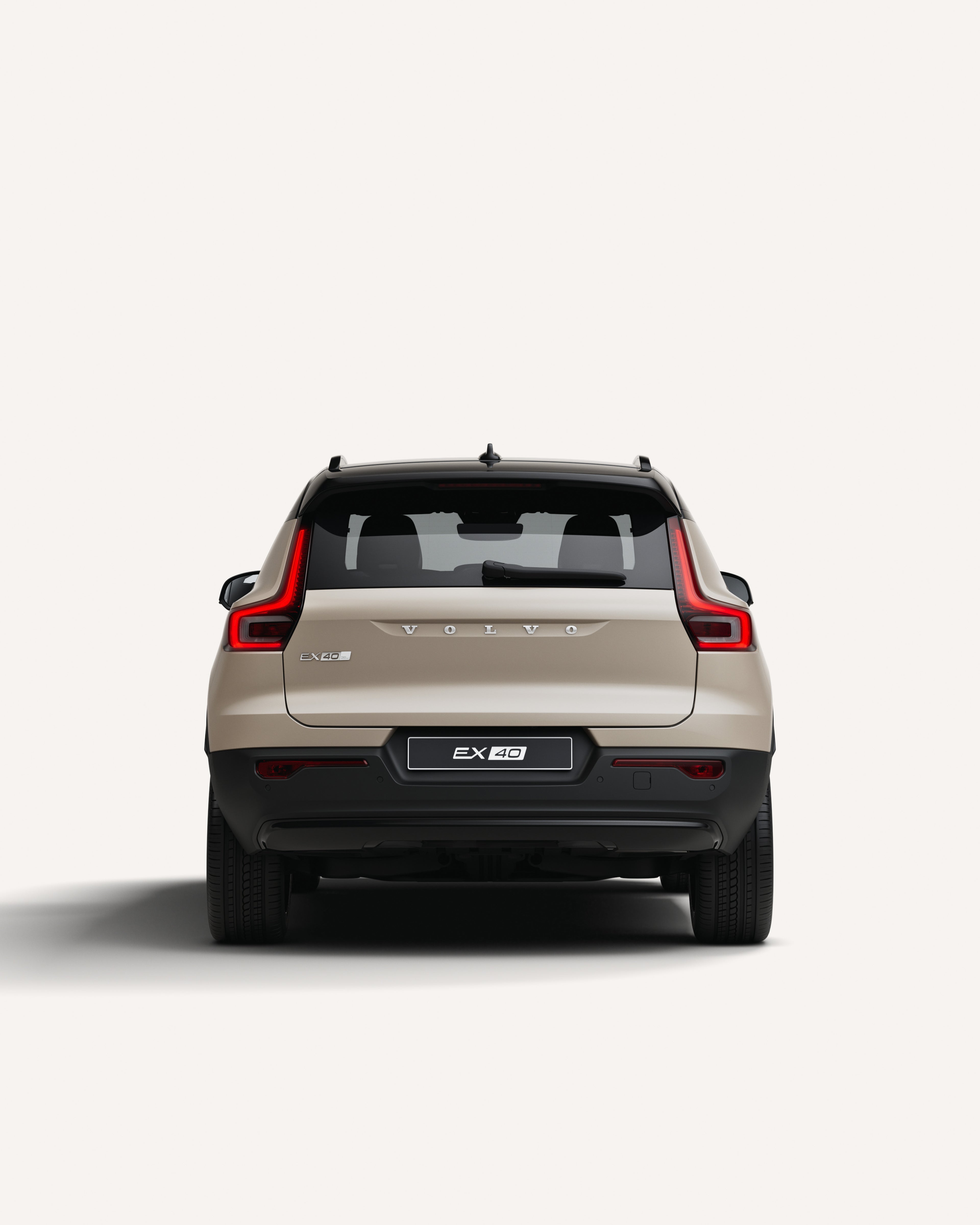 Rear view of the Volvo EX40 in a white studio environment.