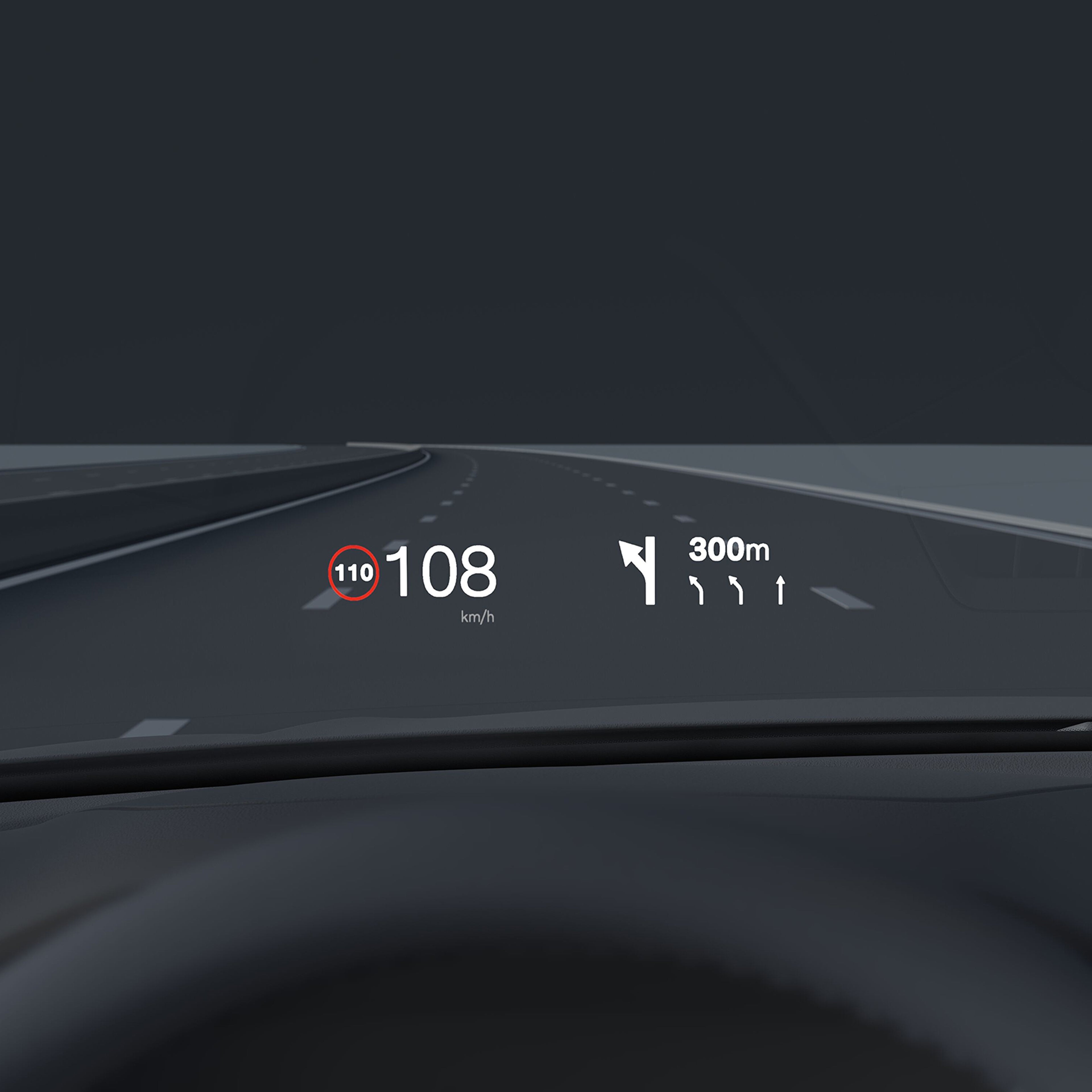 Inside a Volvo, head-up display showing driving speed and navigation on the windshield.