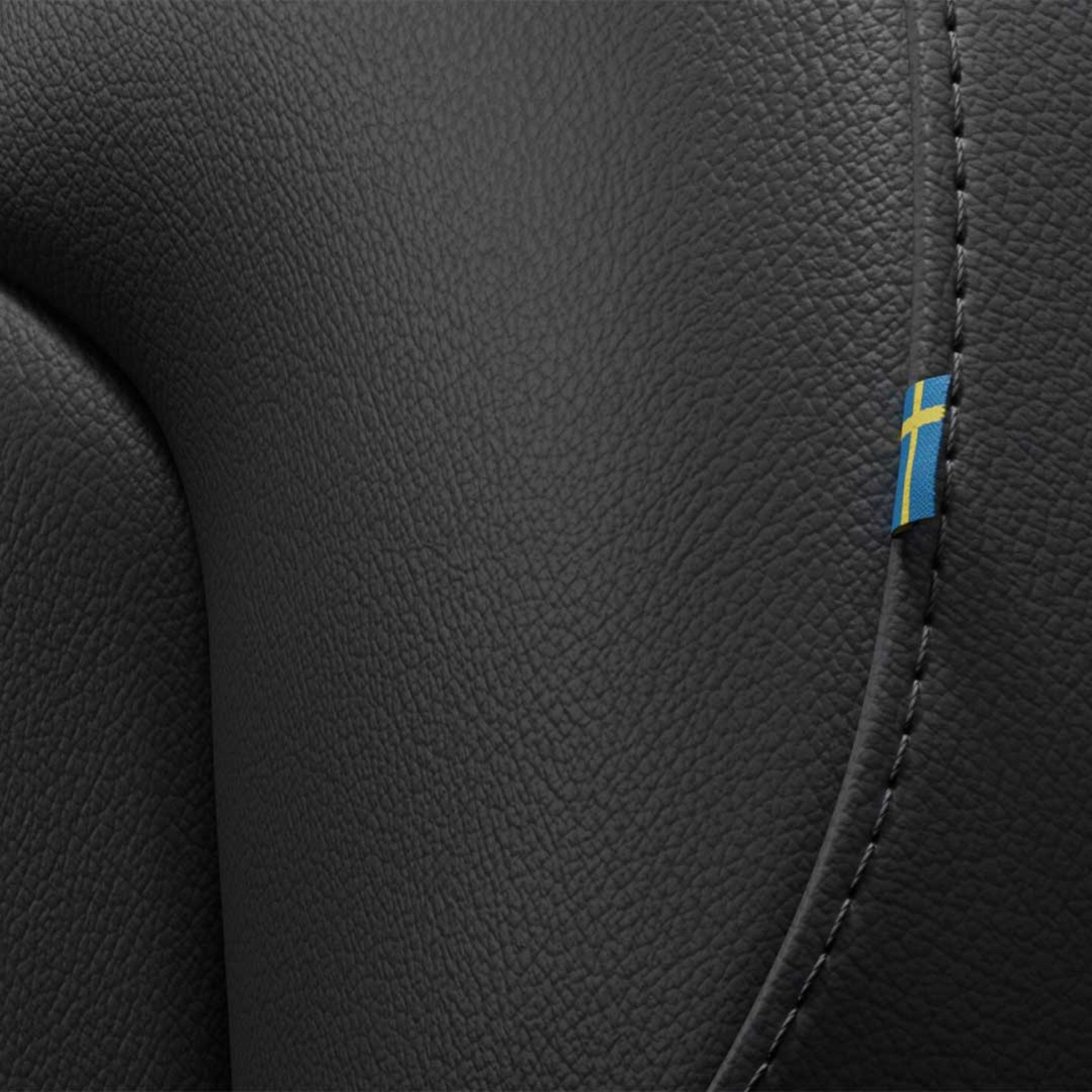 Close-up of the stitching on the Volvo S60 mild hybrid’s front passenger seat featuring a tiny Swedish flag.