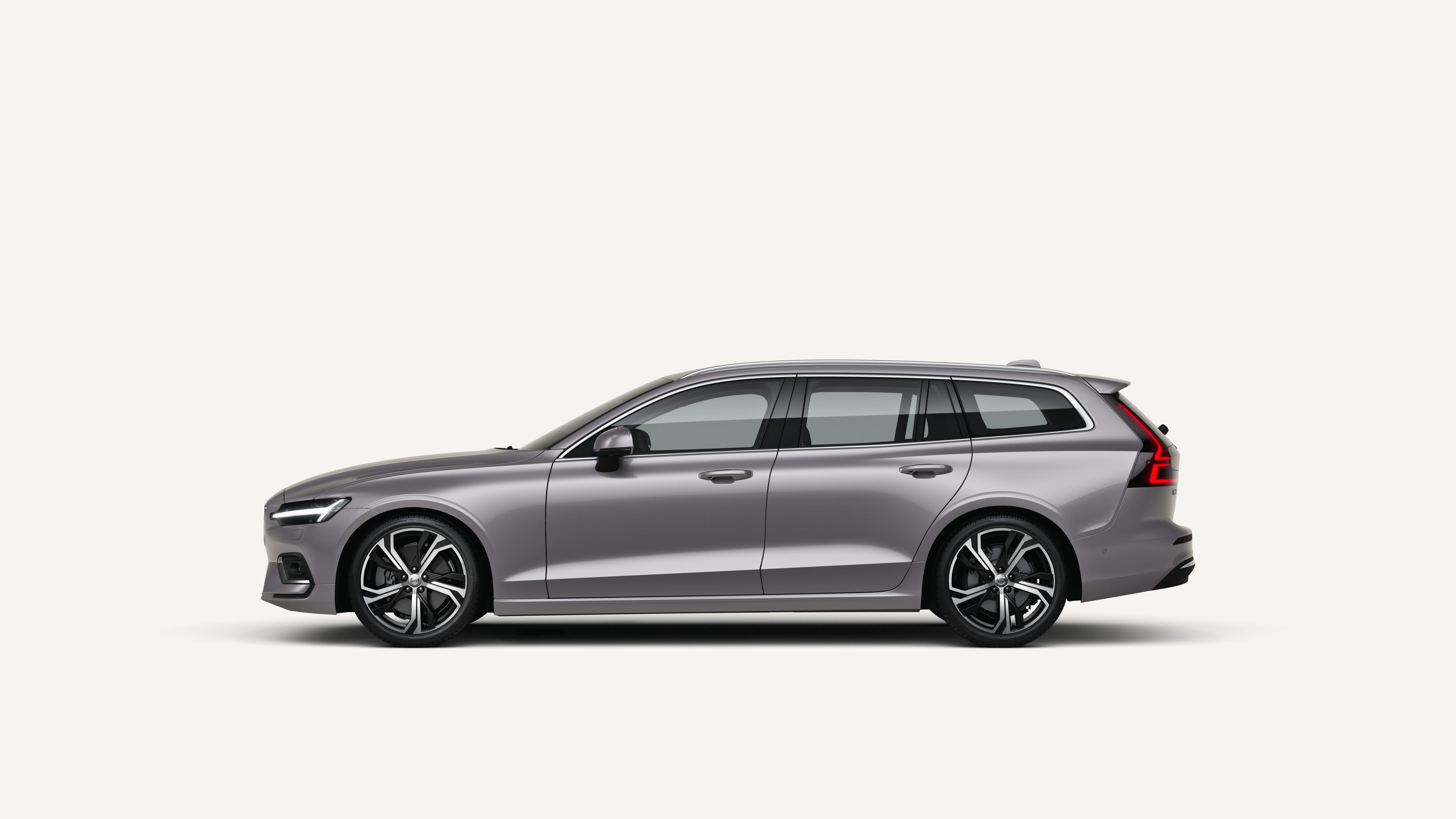 Side view of the Volvo V60 in a white studio environment.