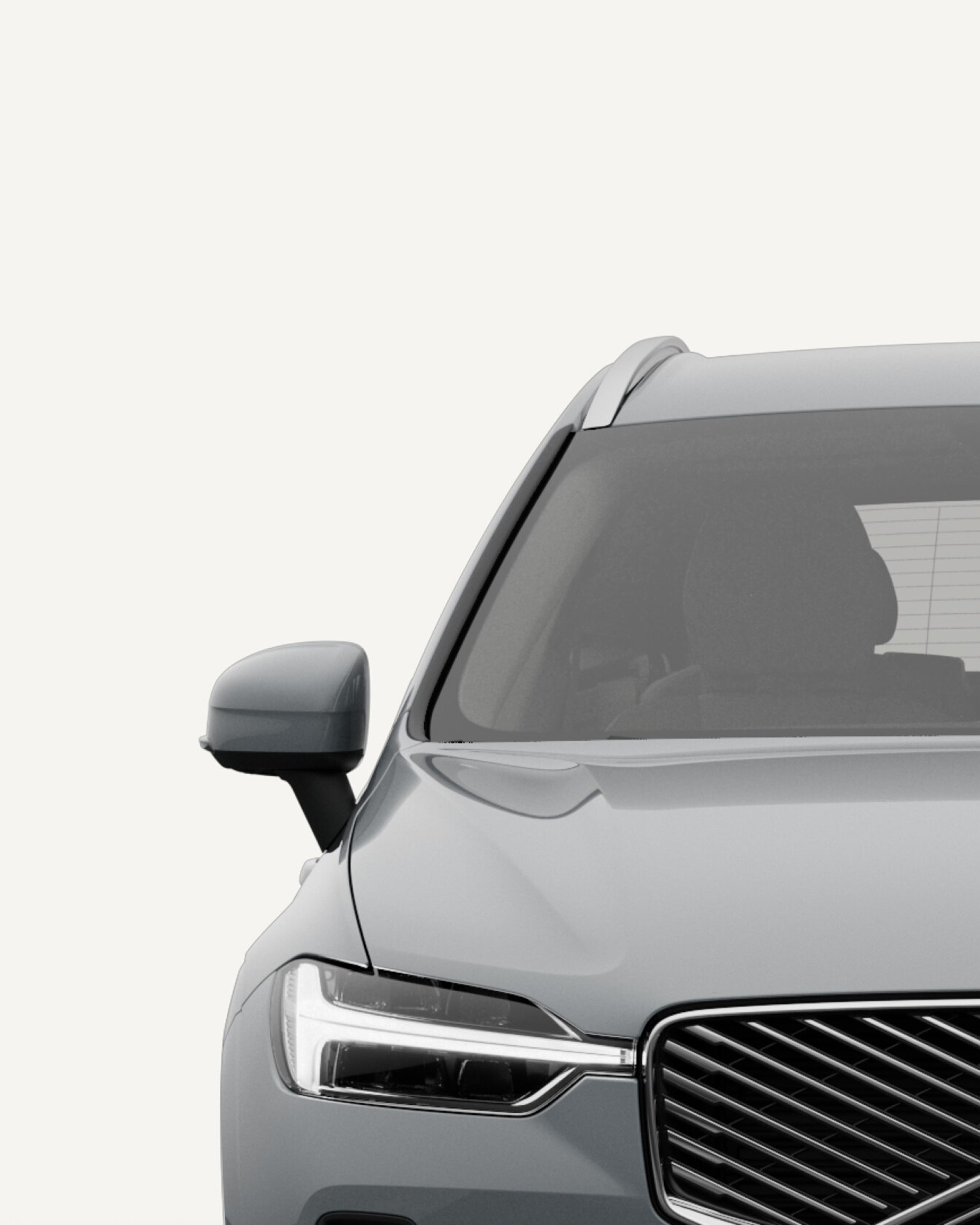 Bird’s-eye view of the Volvo XC60 midsize mild-hybrid SUV in a white studio environment.