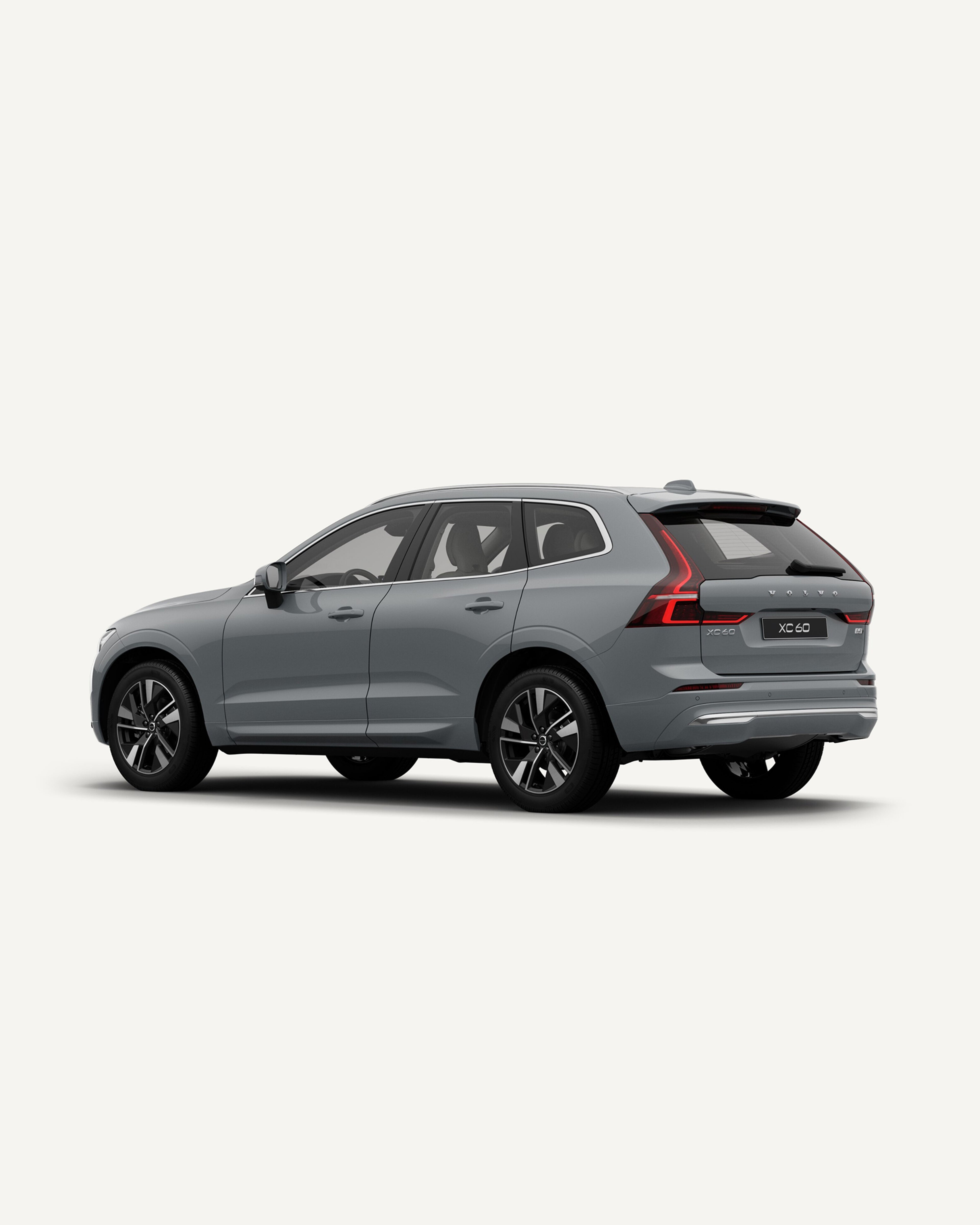 The Volvo XC60 midsize mild hybrid SUV in a white studio environment with all doors open.