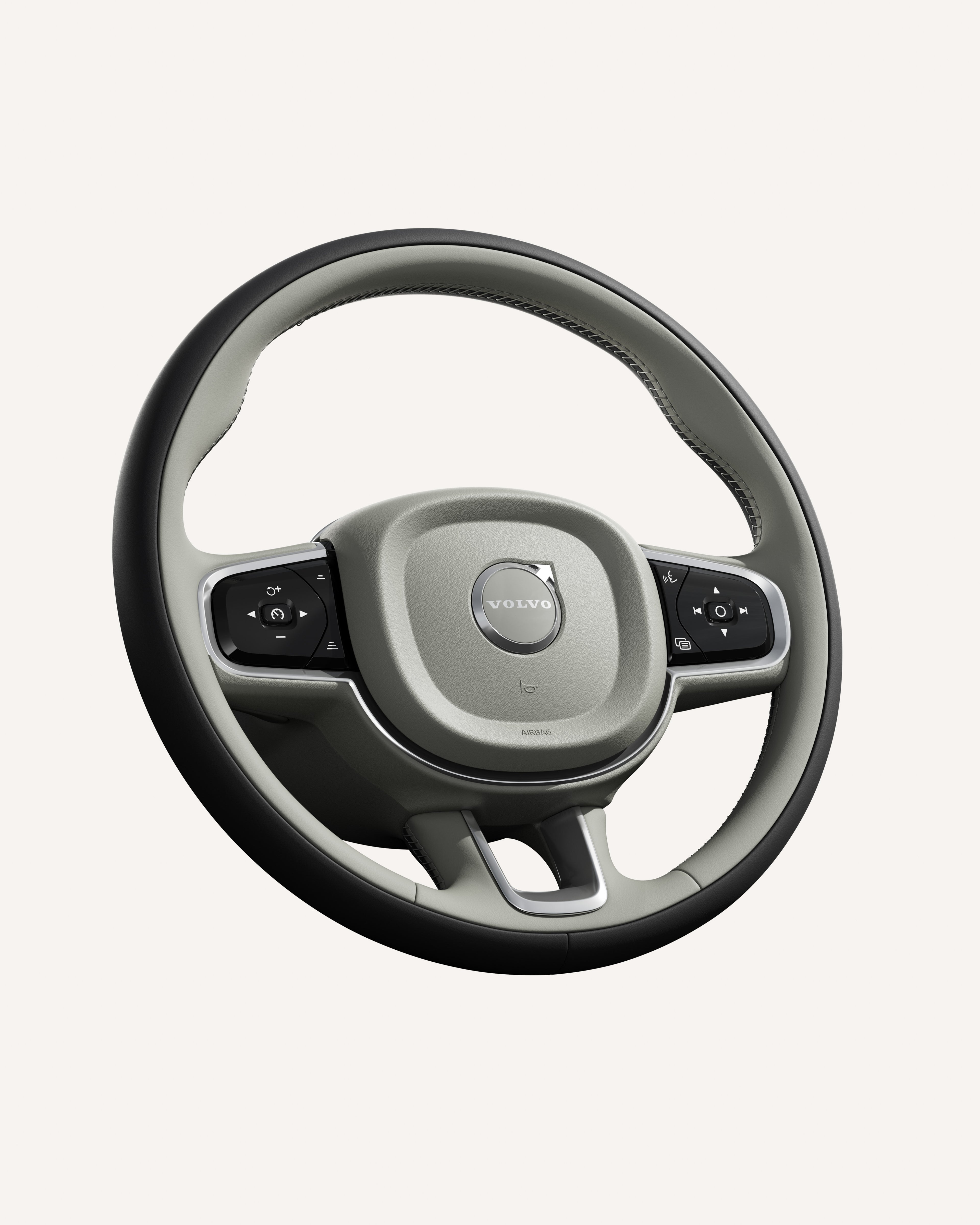 Close-up of the Volvo S90 steering wheel, featuring integrated controls.