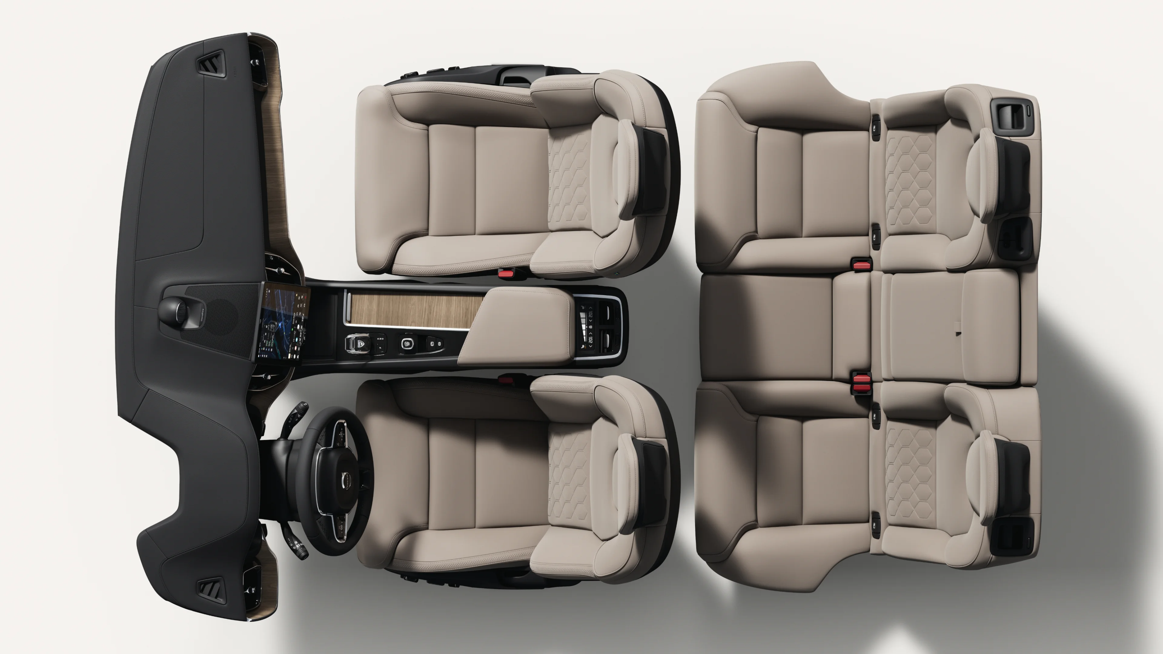 Vista de cima para baixo do interior do Volvo XC60, com os bancos, o painel de instrumentos e a consola central.