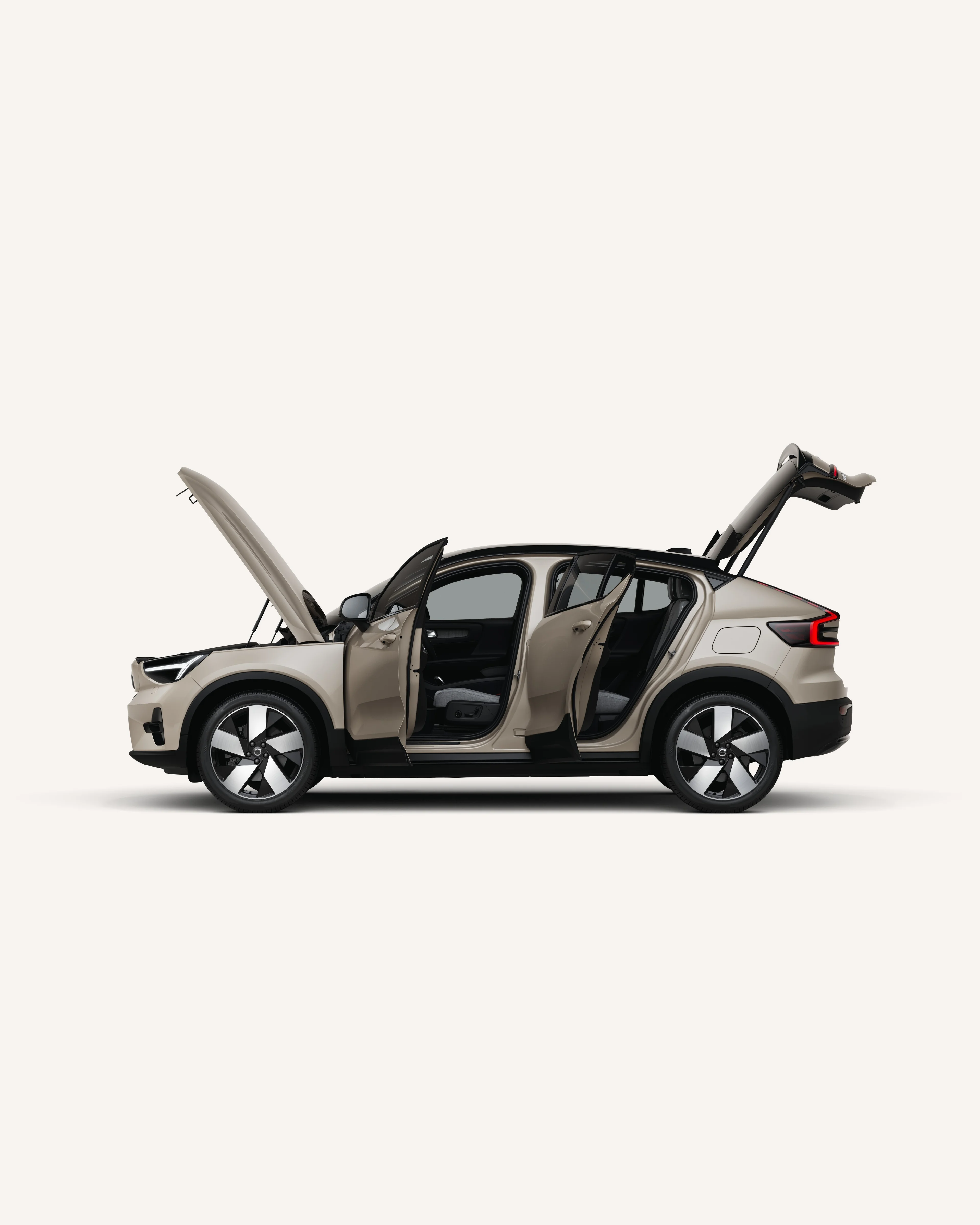 Side view of the fully electric Volvo EC40 with open hood, doors, and trunk.