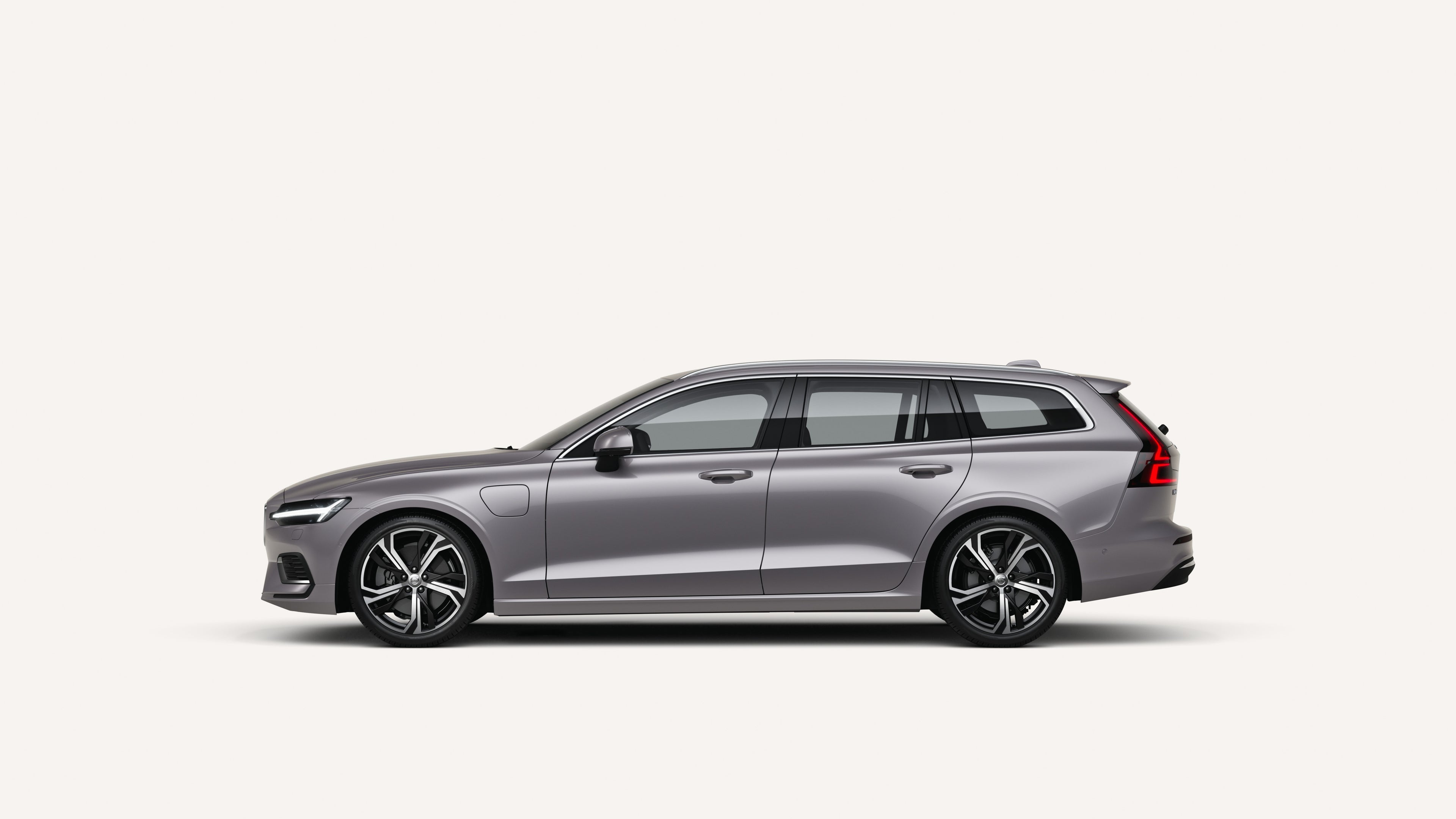 Side view of the Volvo V60 in a white studio environment.
