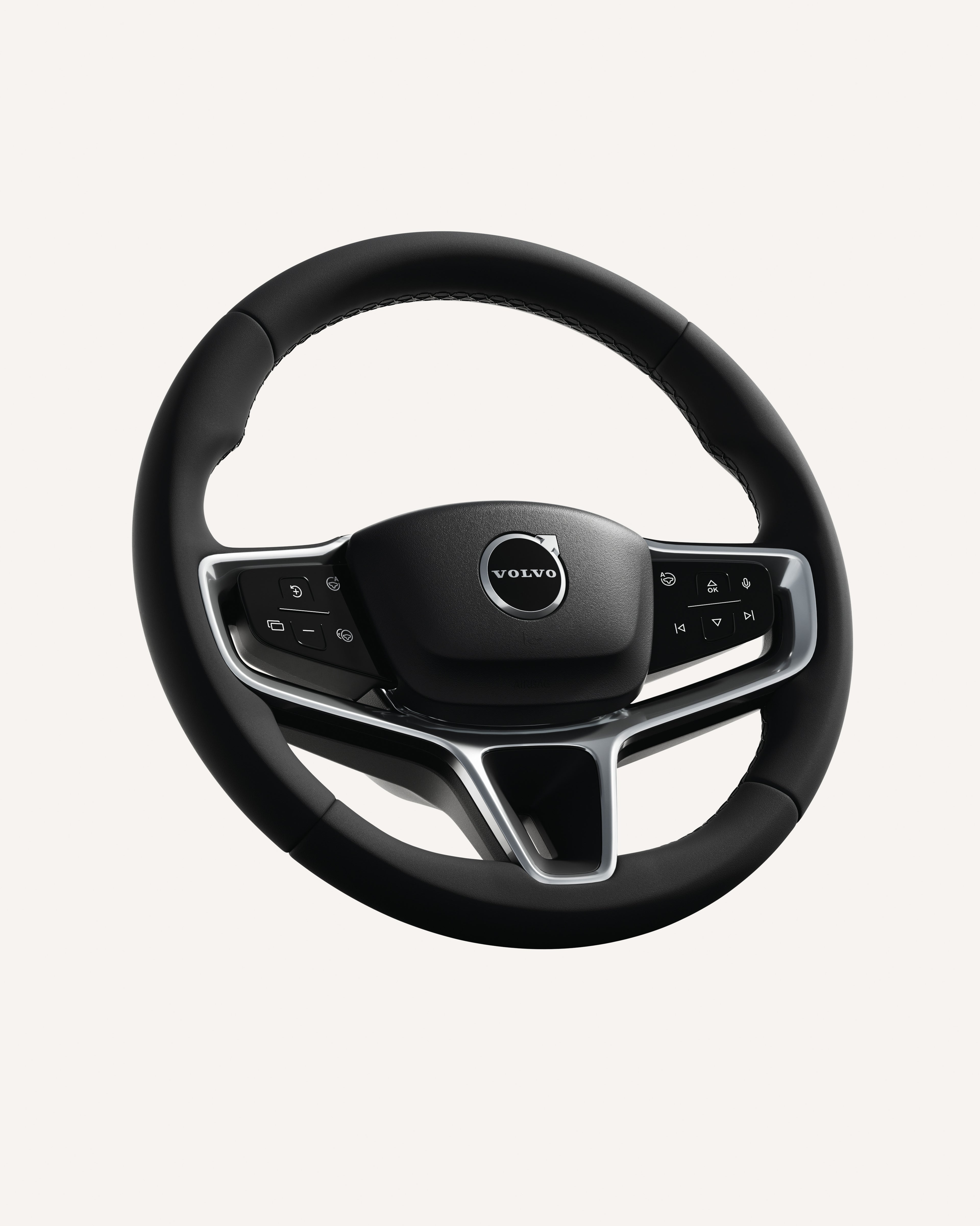 Close-up of the Volvo EX90 steering wheel, featuring integrated controls.