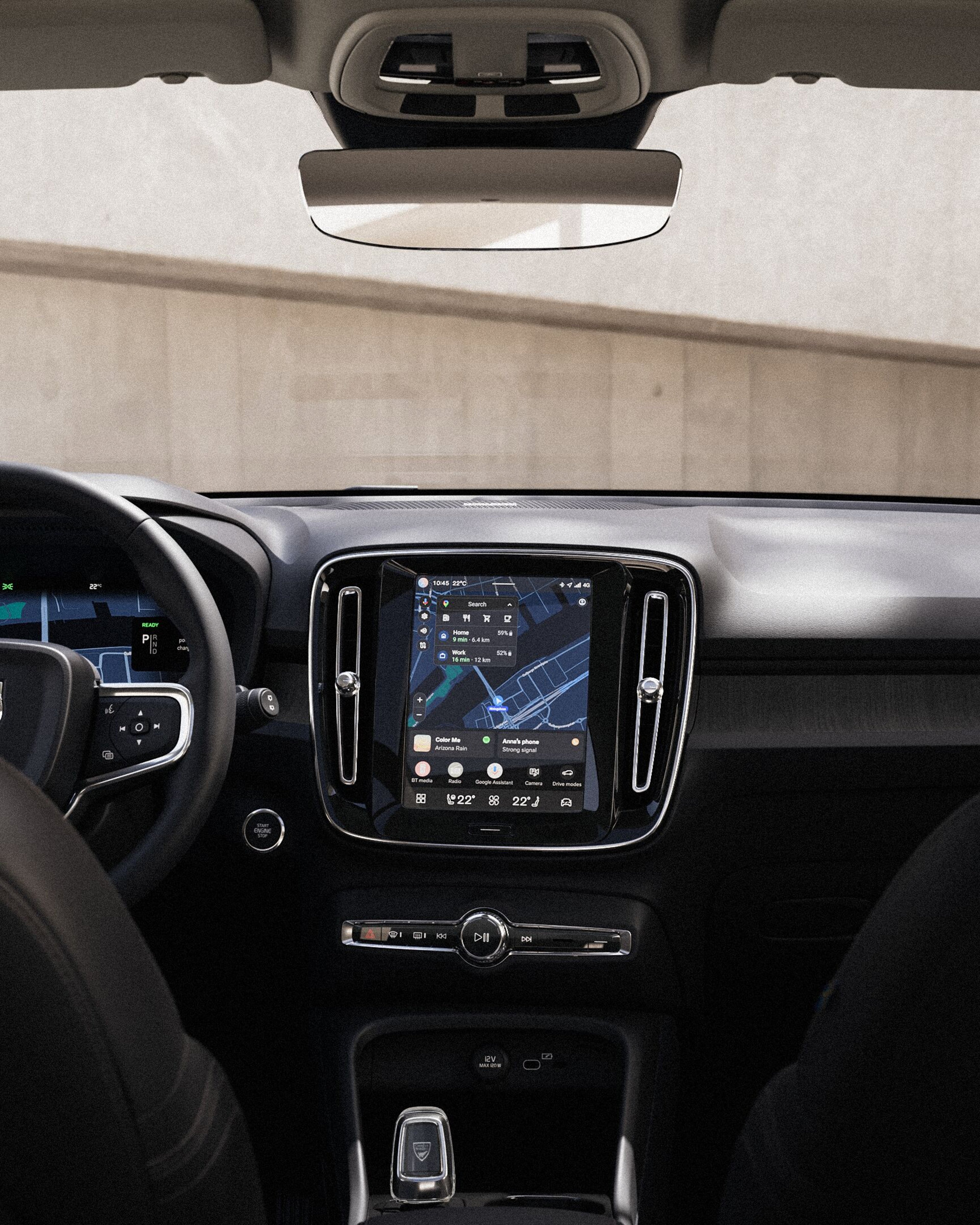 Centralny ekran dotykowy wyświetlający elementy sterujące nawigacją i multimediami w Volvo XC40.